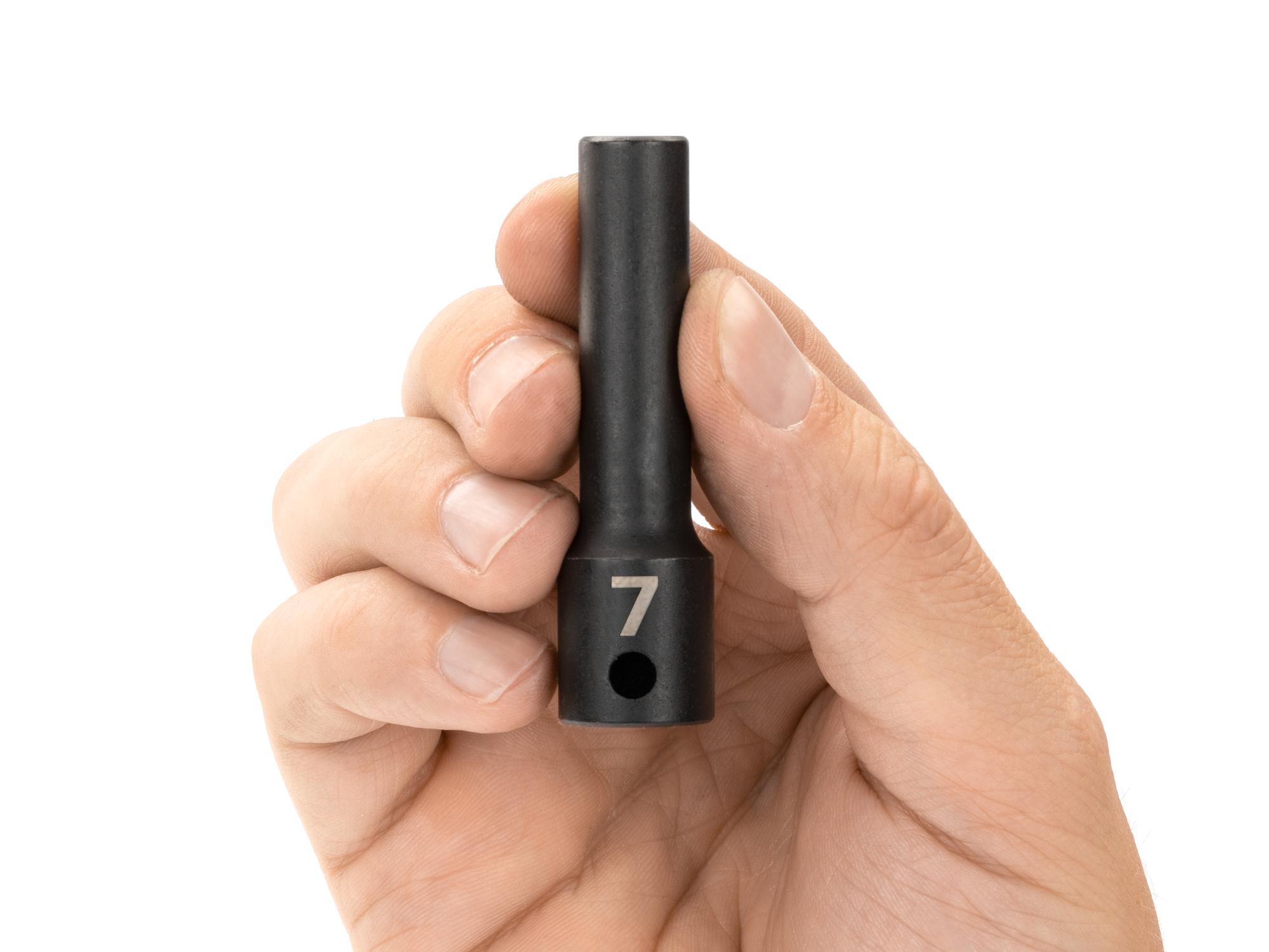 Person holding Tekton impact drive 12-point socket. Item #SID13307
