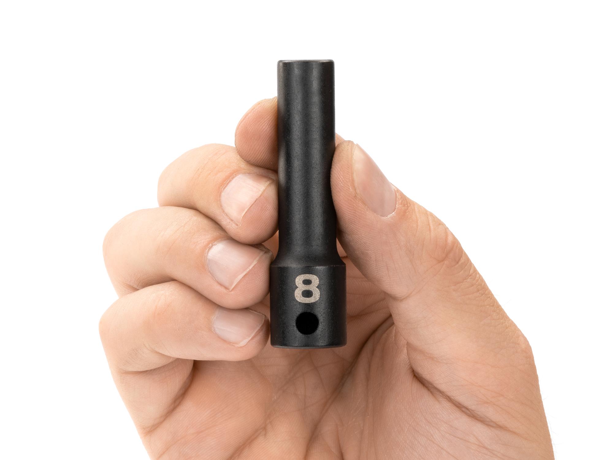 Person holding Tekton impact drive 12-point socket. Item #SID13308