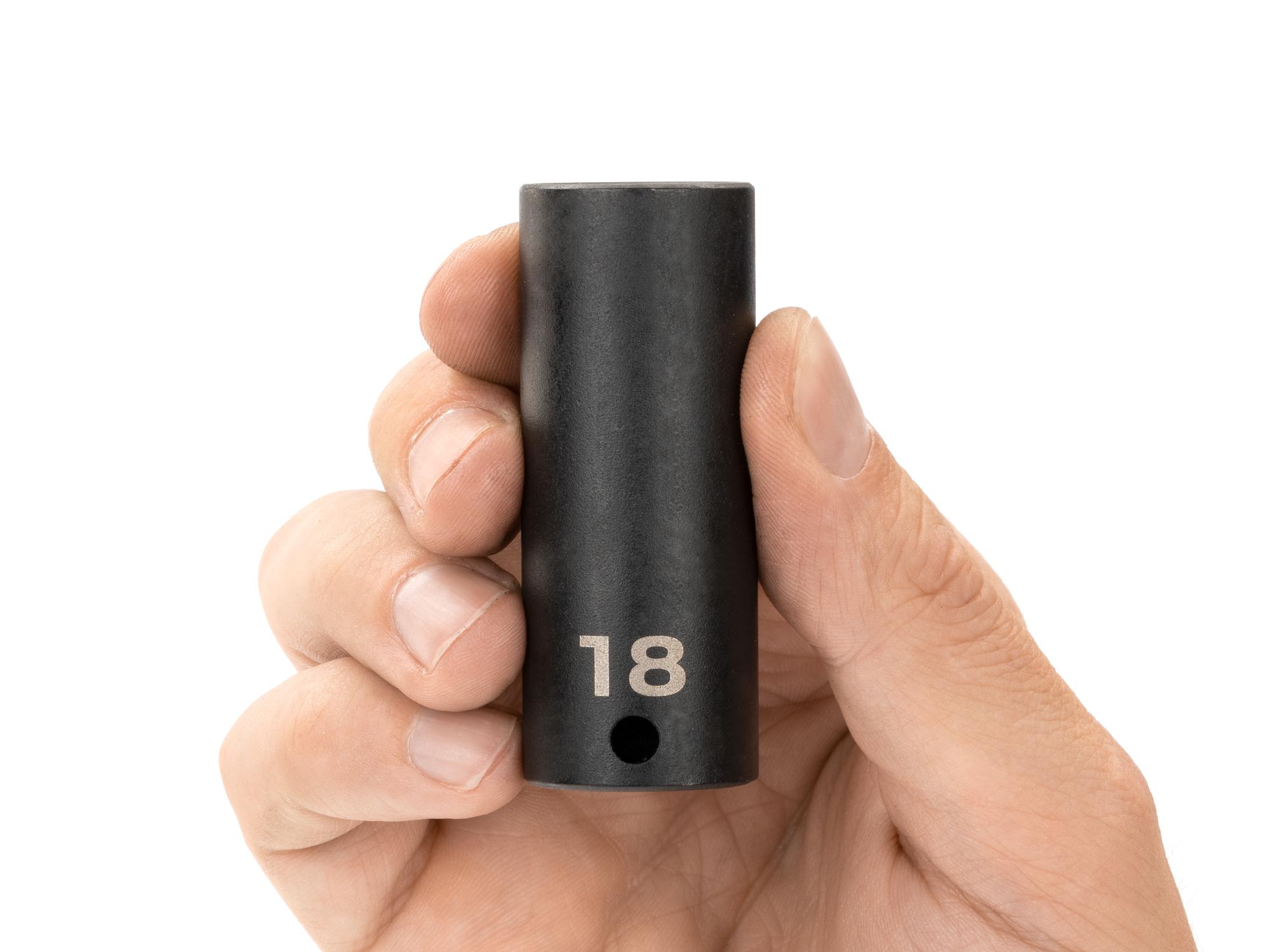 Person holding Tekton impact drive 12-point socket. Item #SID13318