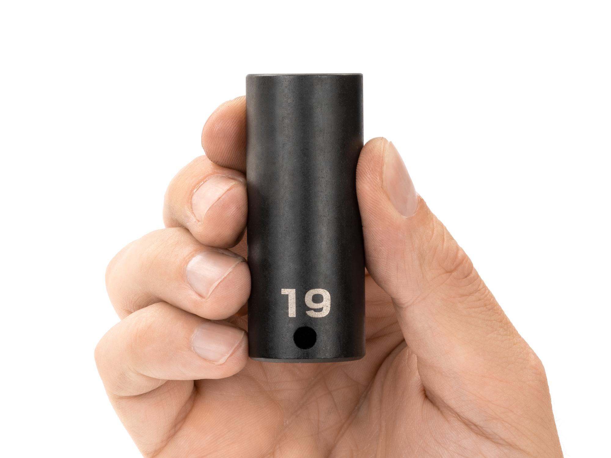 Person holding Tekton impact drive 12-point socket. Item #SID13319