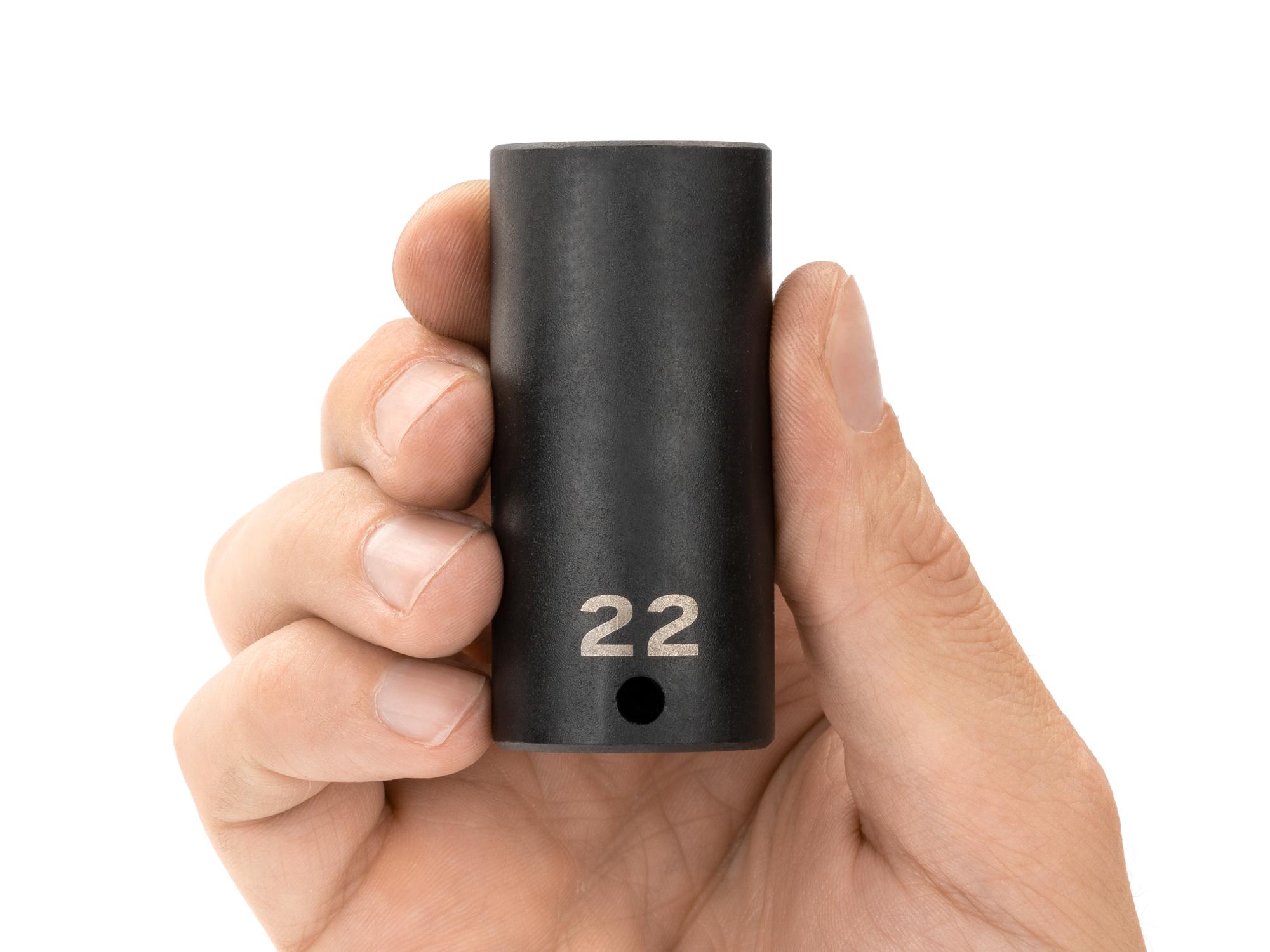 Person holding Tekton impact drive 12-point socket. Item #SID13322