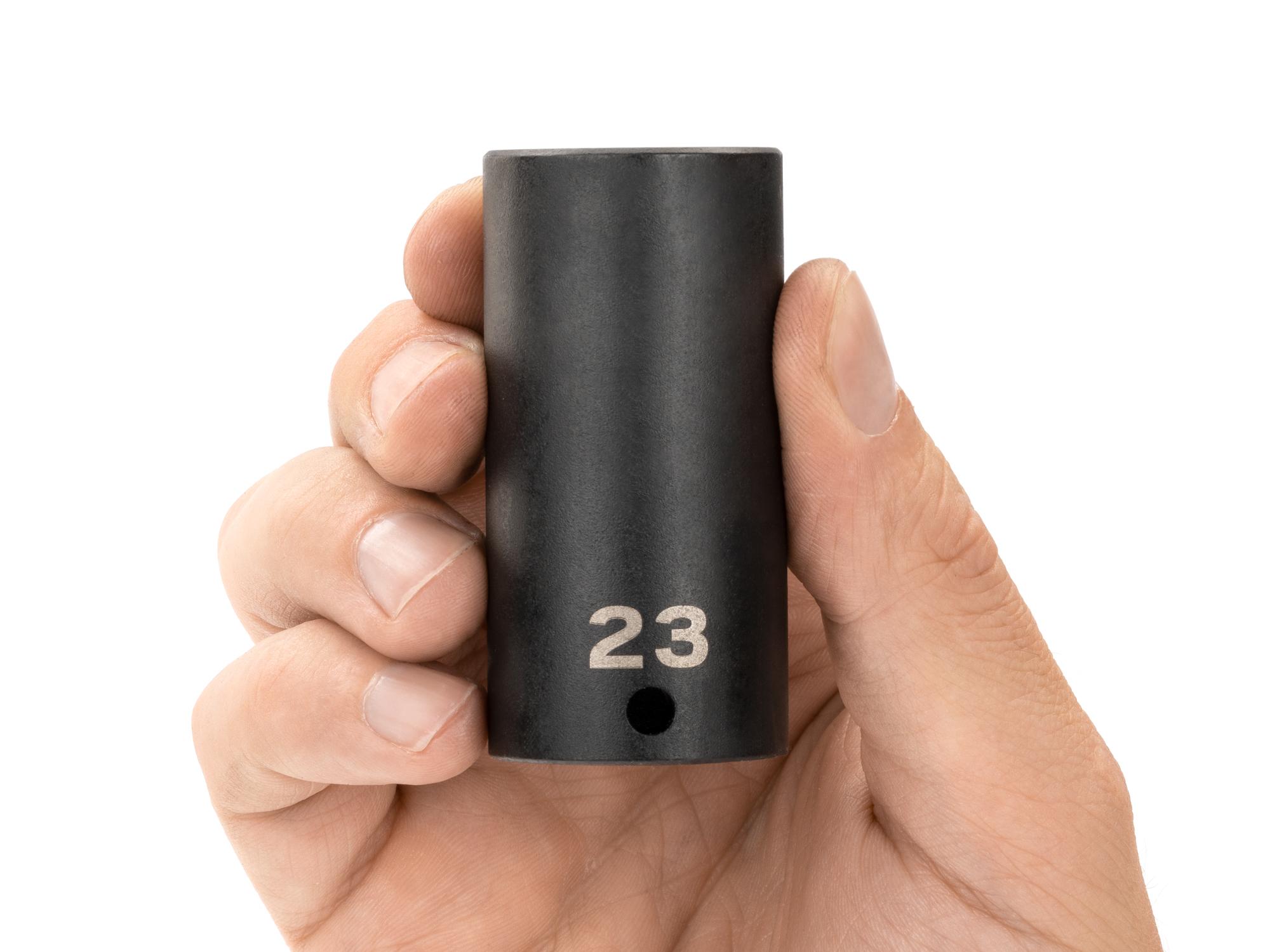 Person holding Tekton impact drive 12-point socket. Item #SID13323