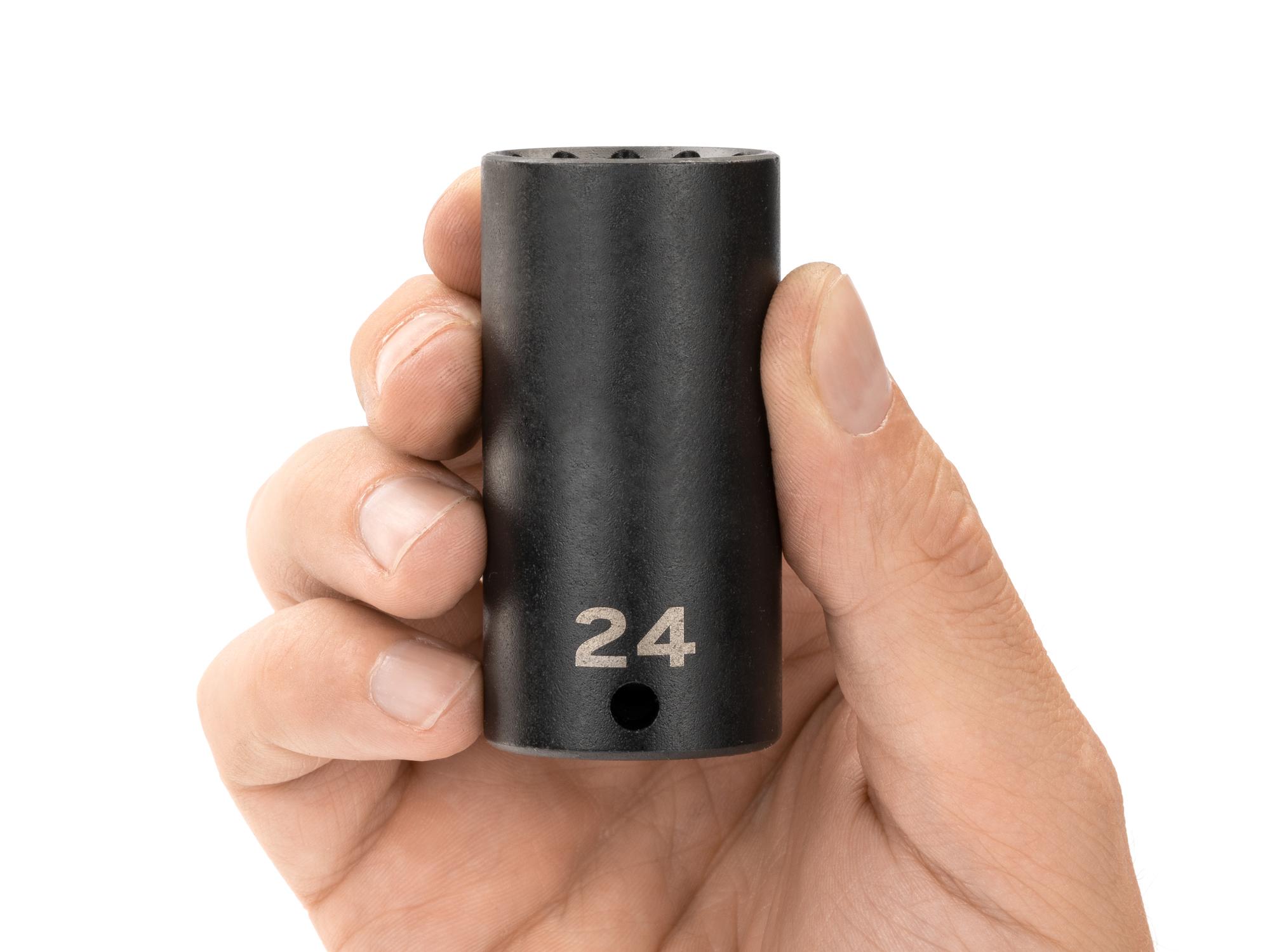Person holding Tekton impact drive 12-point socket. Item #SID13324