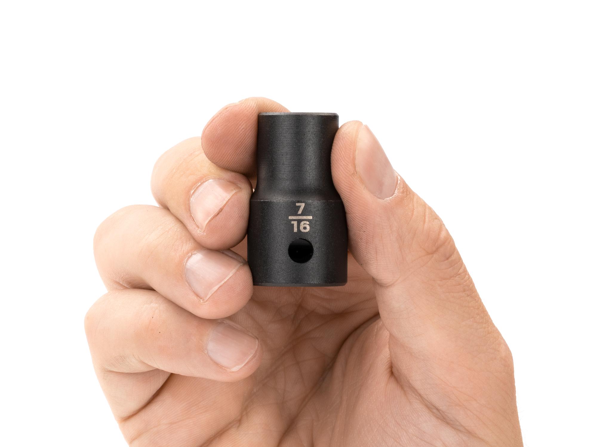 Person holding Tekton impact drive 12-point socket. Item #SID22211