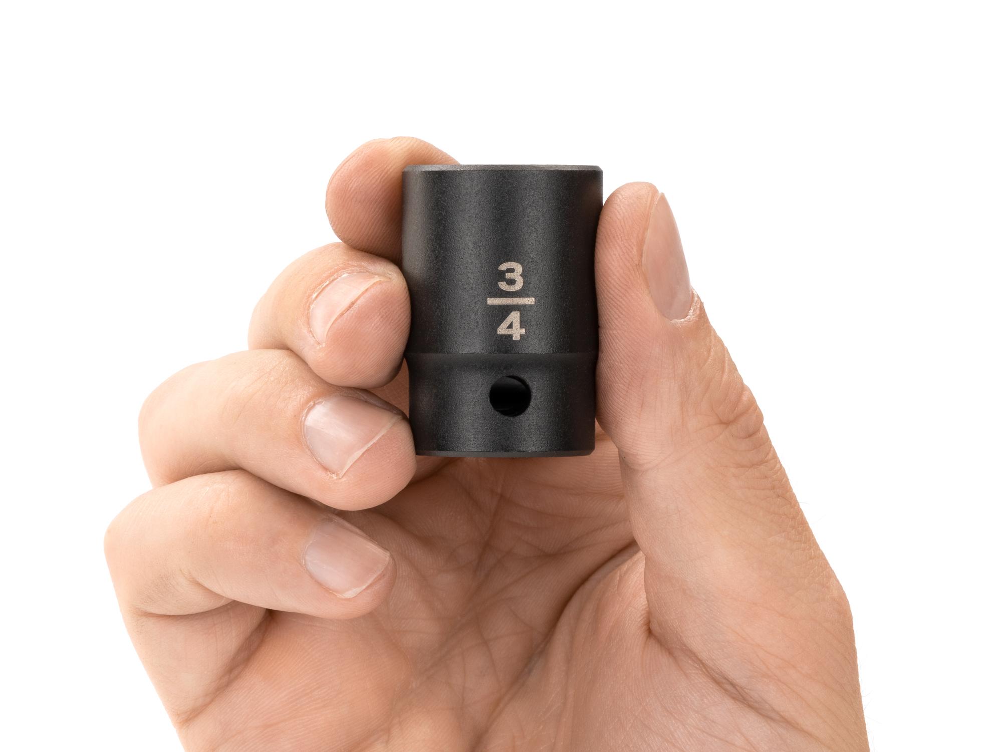 Person holding Tekton impact drive 12-point socket. Item #SID22219