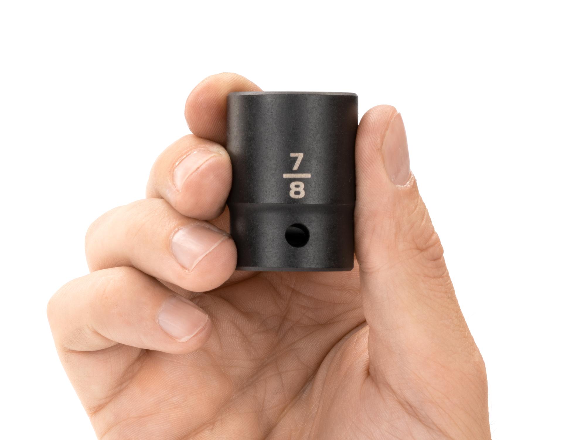 Person holding Tekton impact drive 12-point socket. Item #SID22222