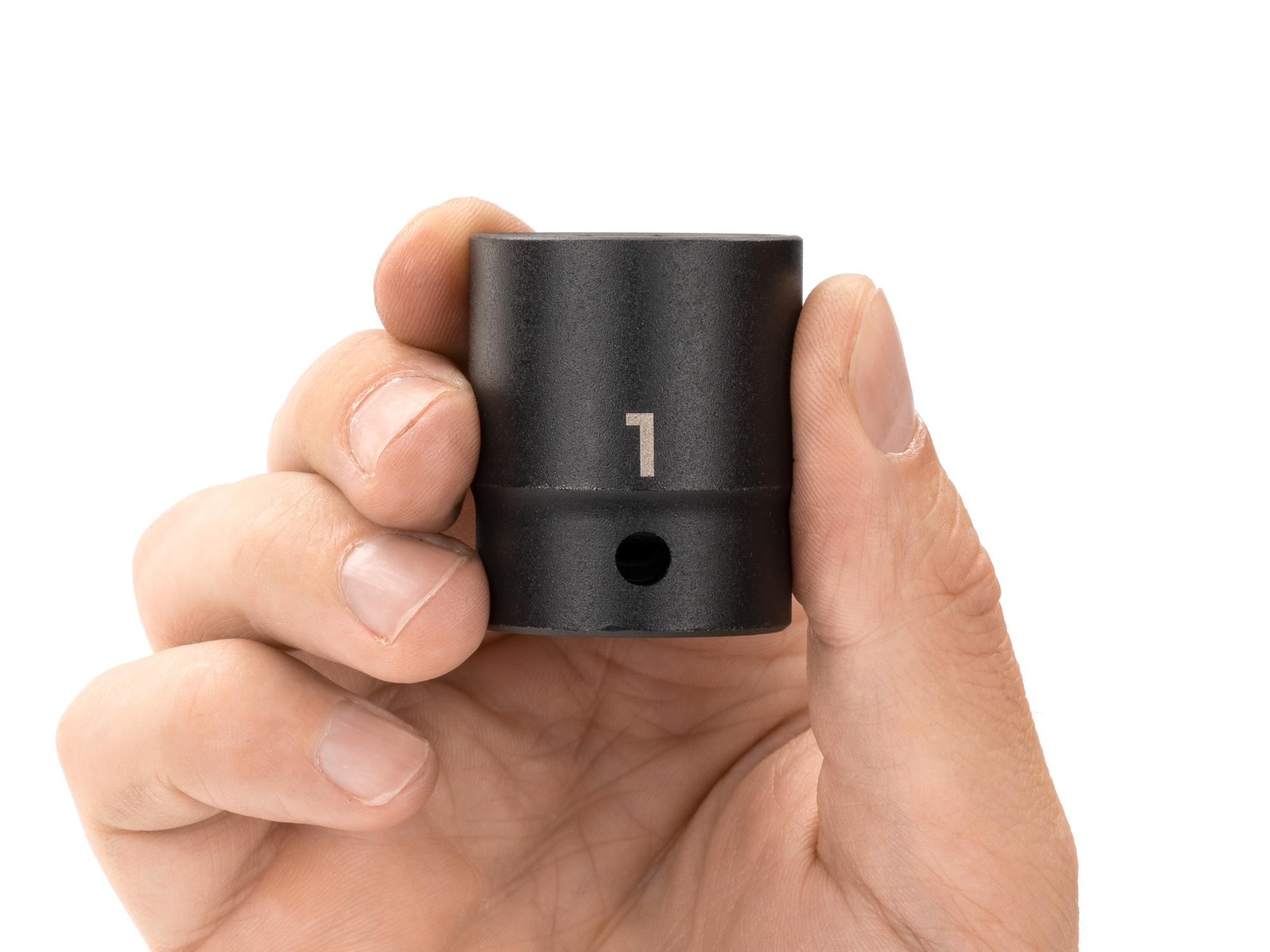 Person holding Tekton impact drive 12-point socket. Item #SID22225