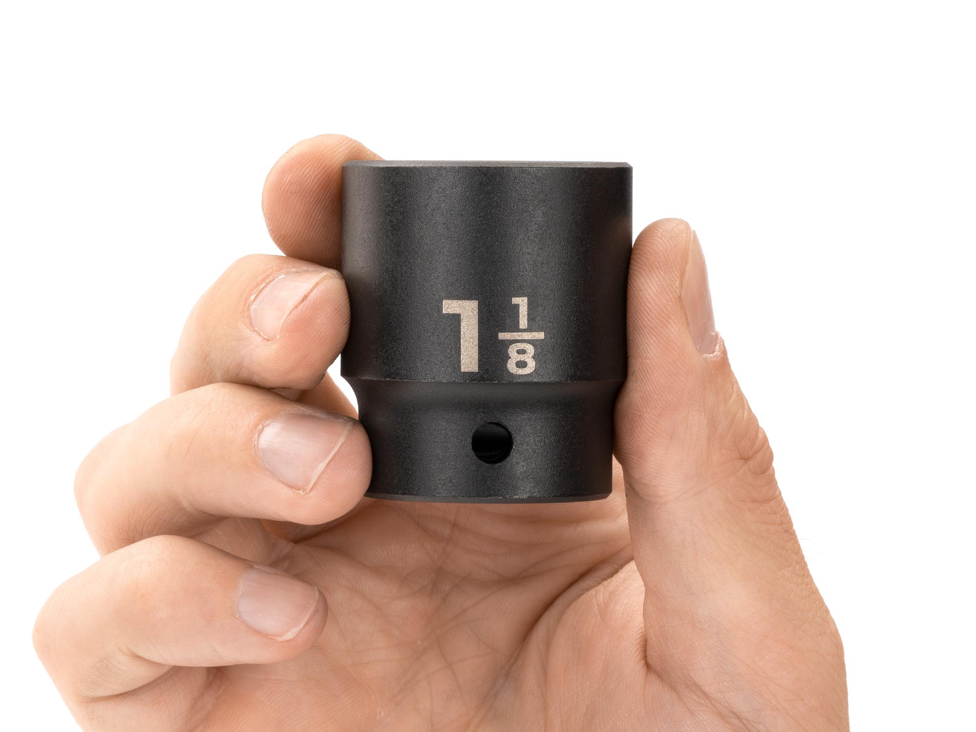 Person holding Tekton impact drive 12-point socket. Item #SID22229