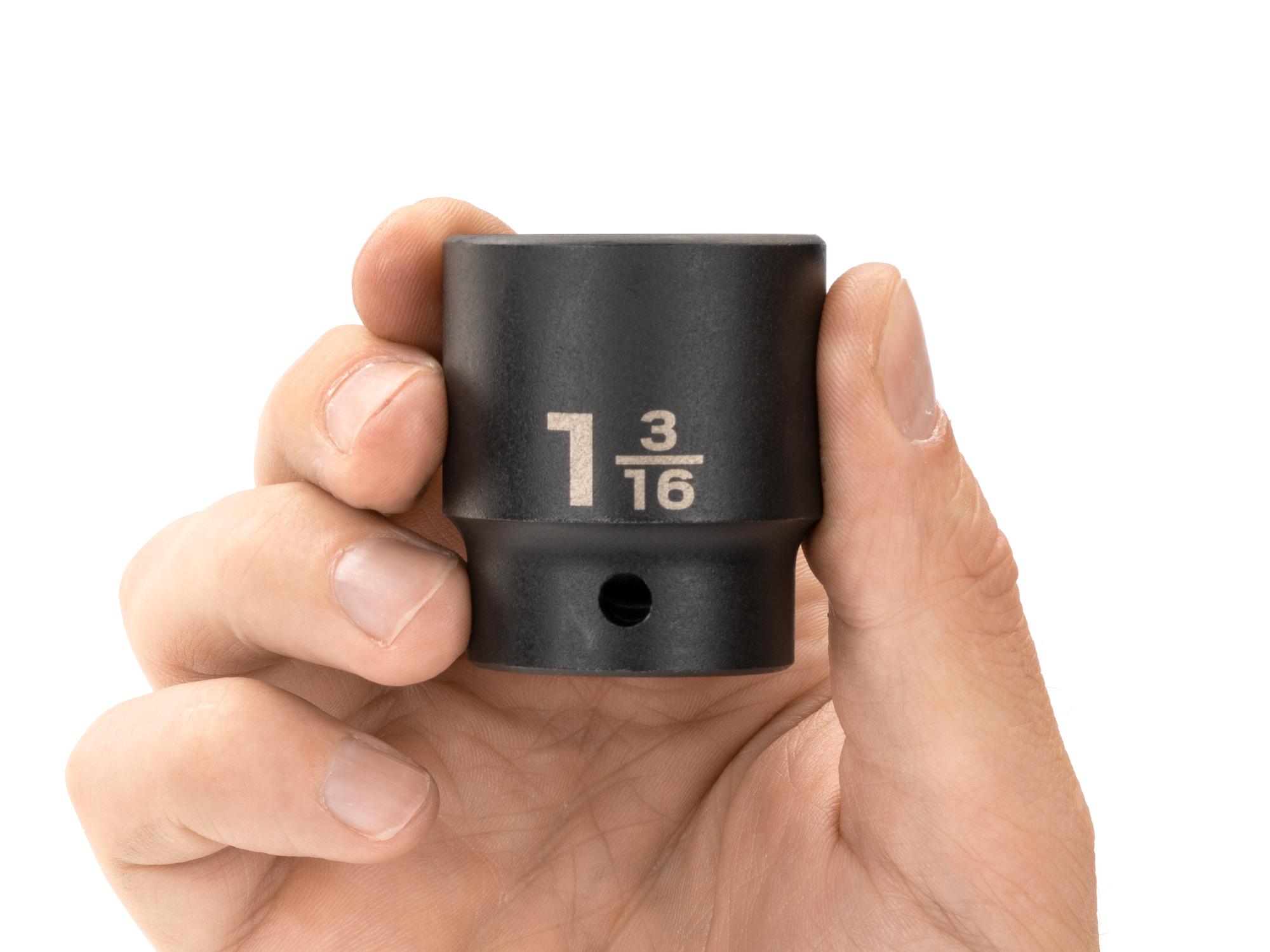 Person holding Tekton impact drive 12-point socket. Item #SID22230