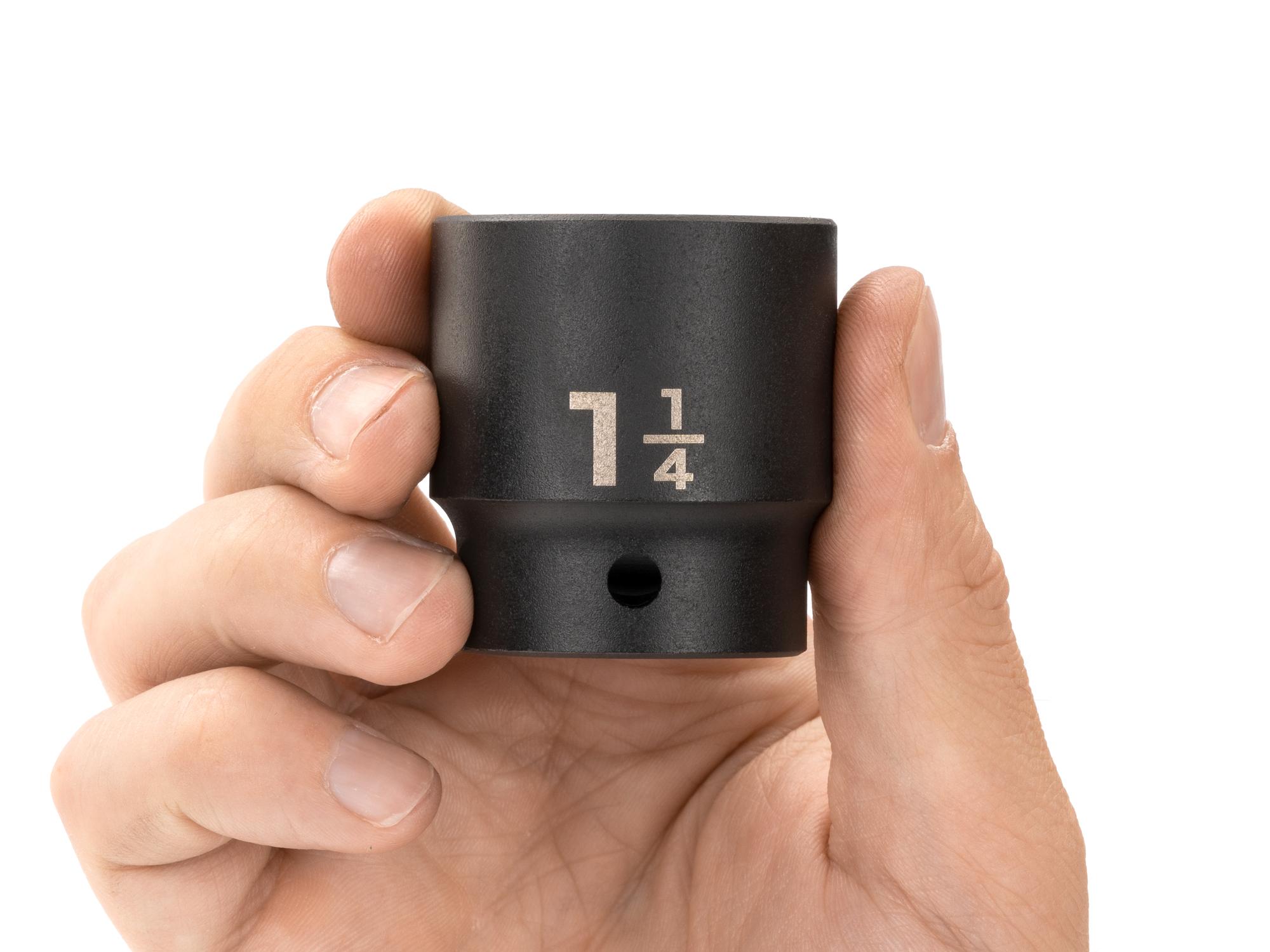 Person holding Tekton impact drive 12-point socket. Item #SID22232