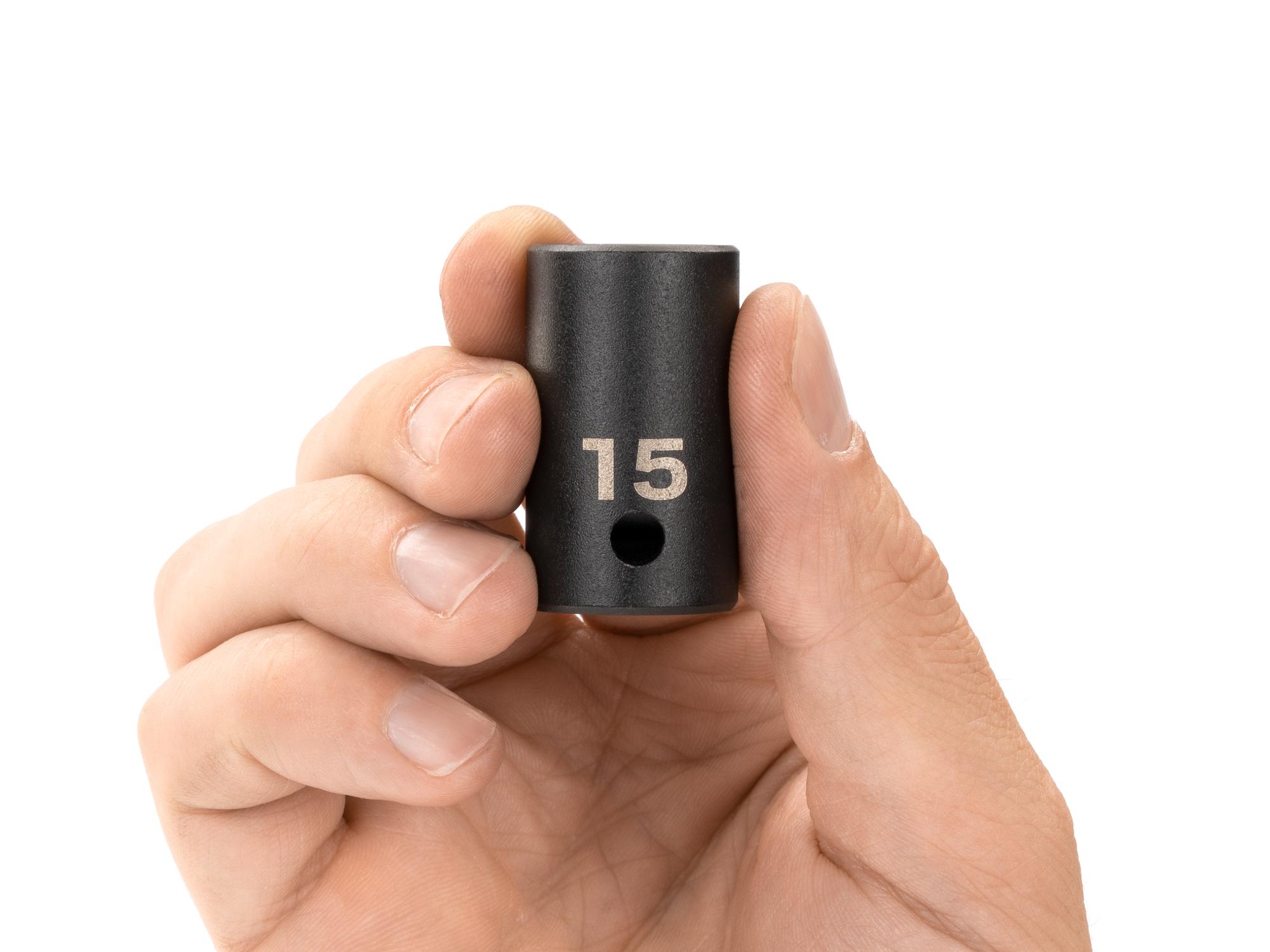 Person holding Tekton impact drive 12-point socket. Item #SID22315