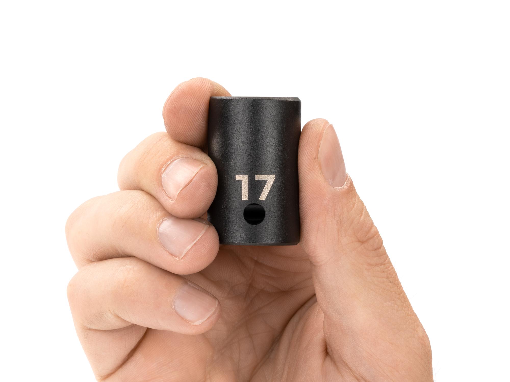 Person holding Tekton impact drive 12-point socket. Item #SID22317