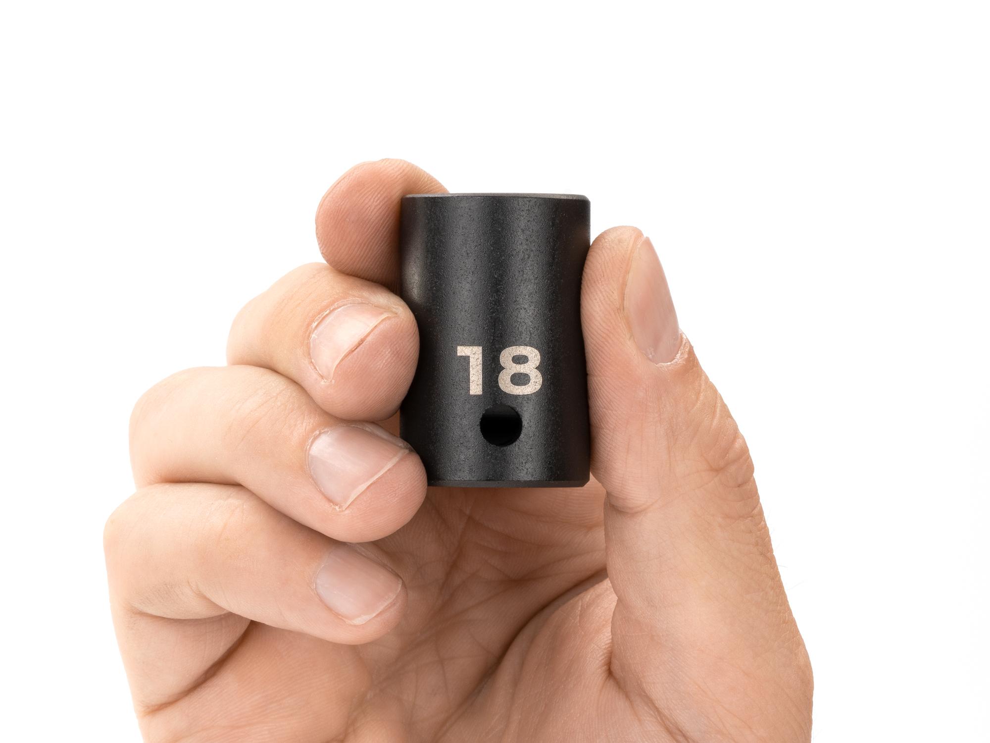 Person holding Tekton impact drive 12-point socket. Item #SID22318
