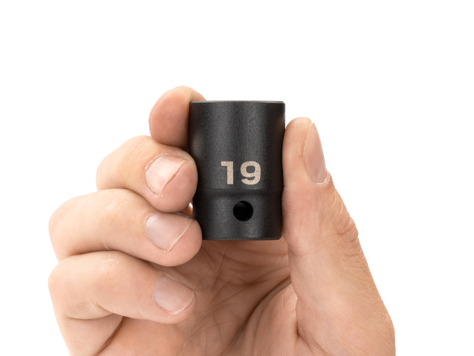Person holding Tekton impact drive 12-point socket. Item #SID22319