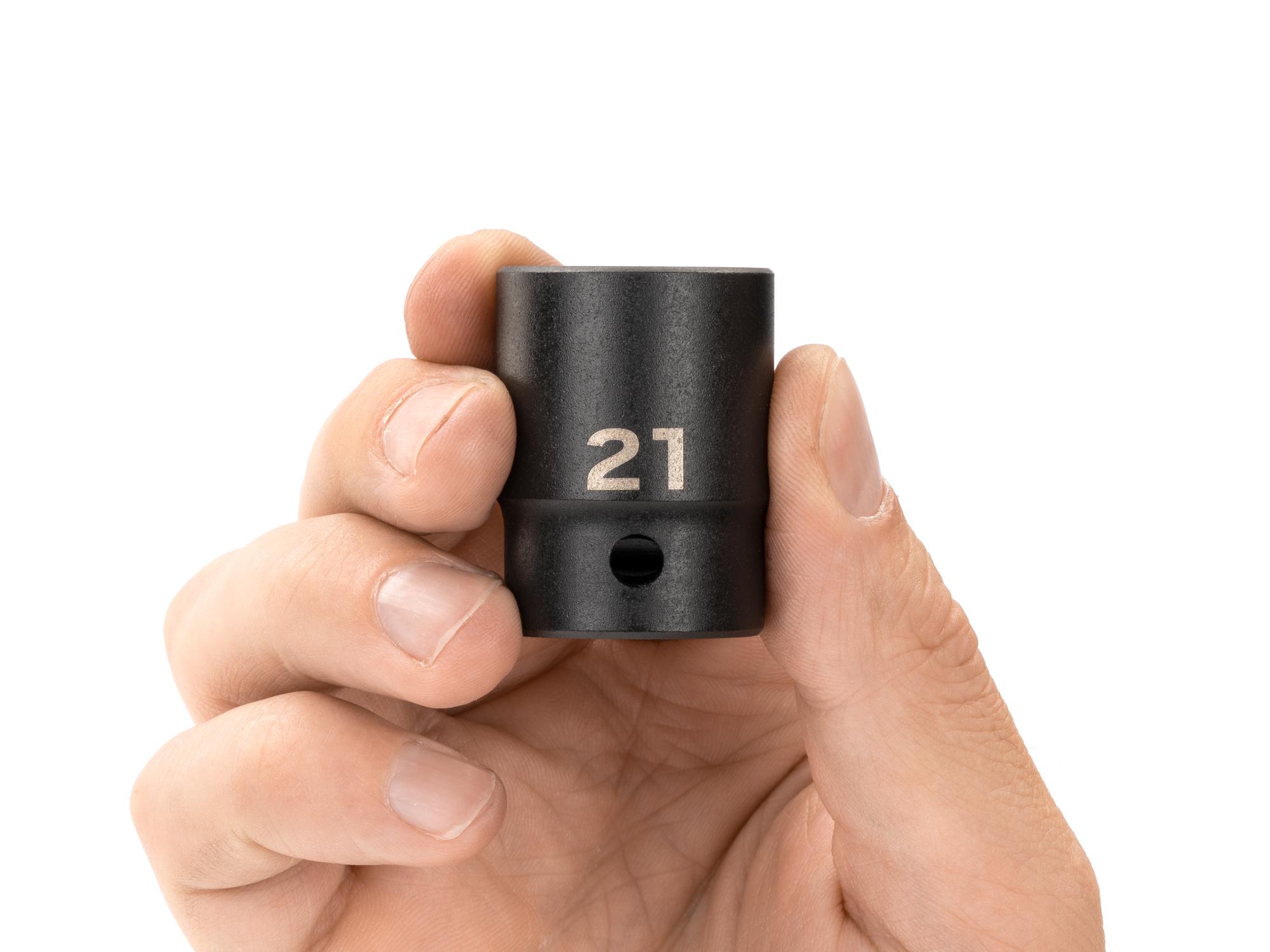Person holding Tekton impact drive 12-point socket. Item #SID22321