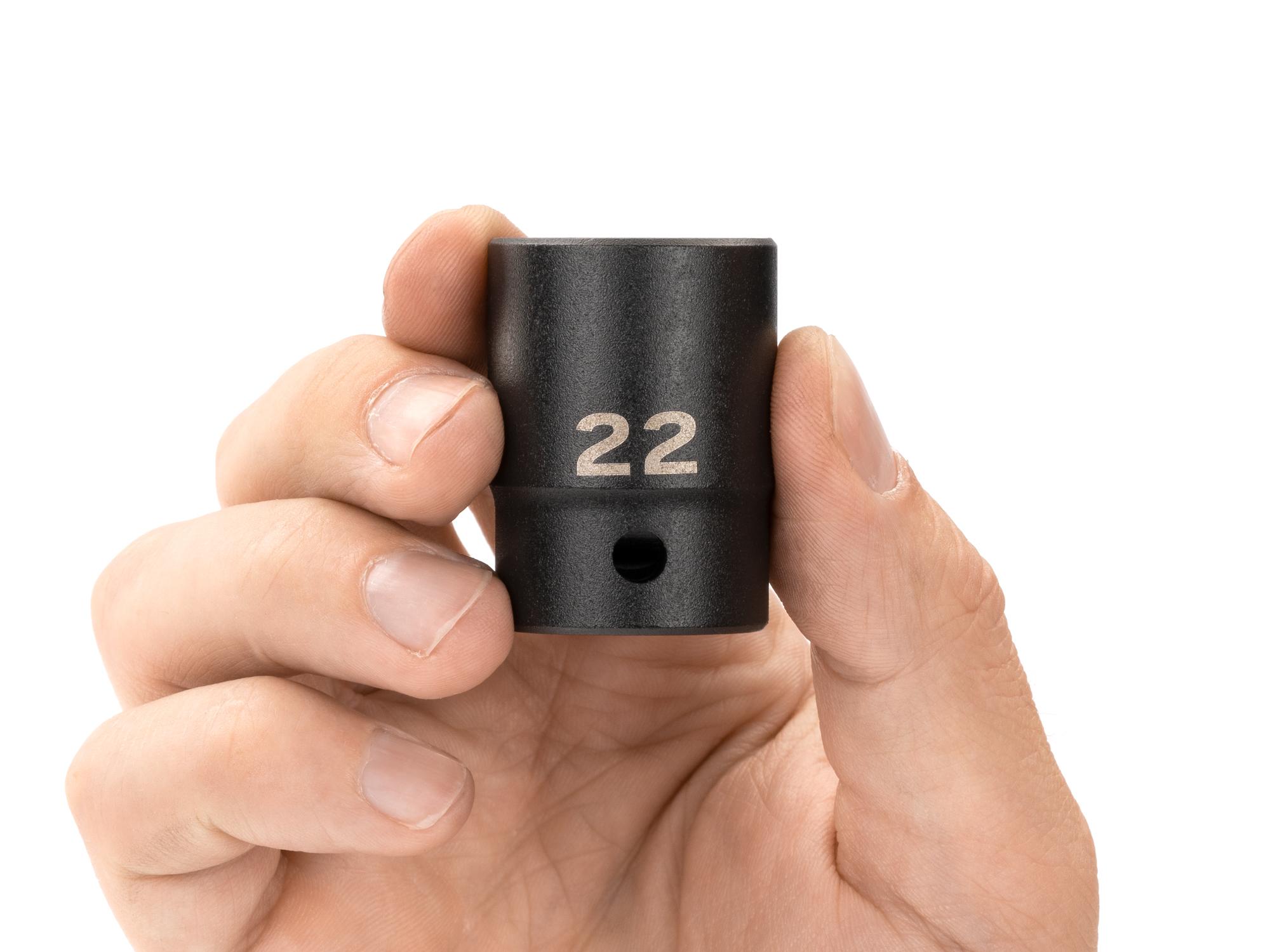 Person holding Tekton impact drive 12-point socket. Item #SID22322