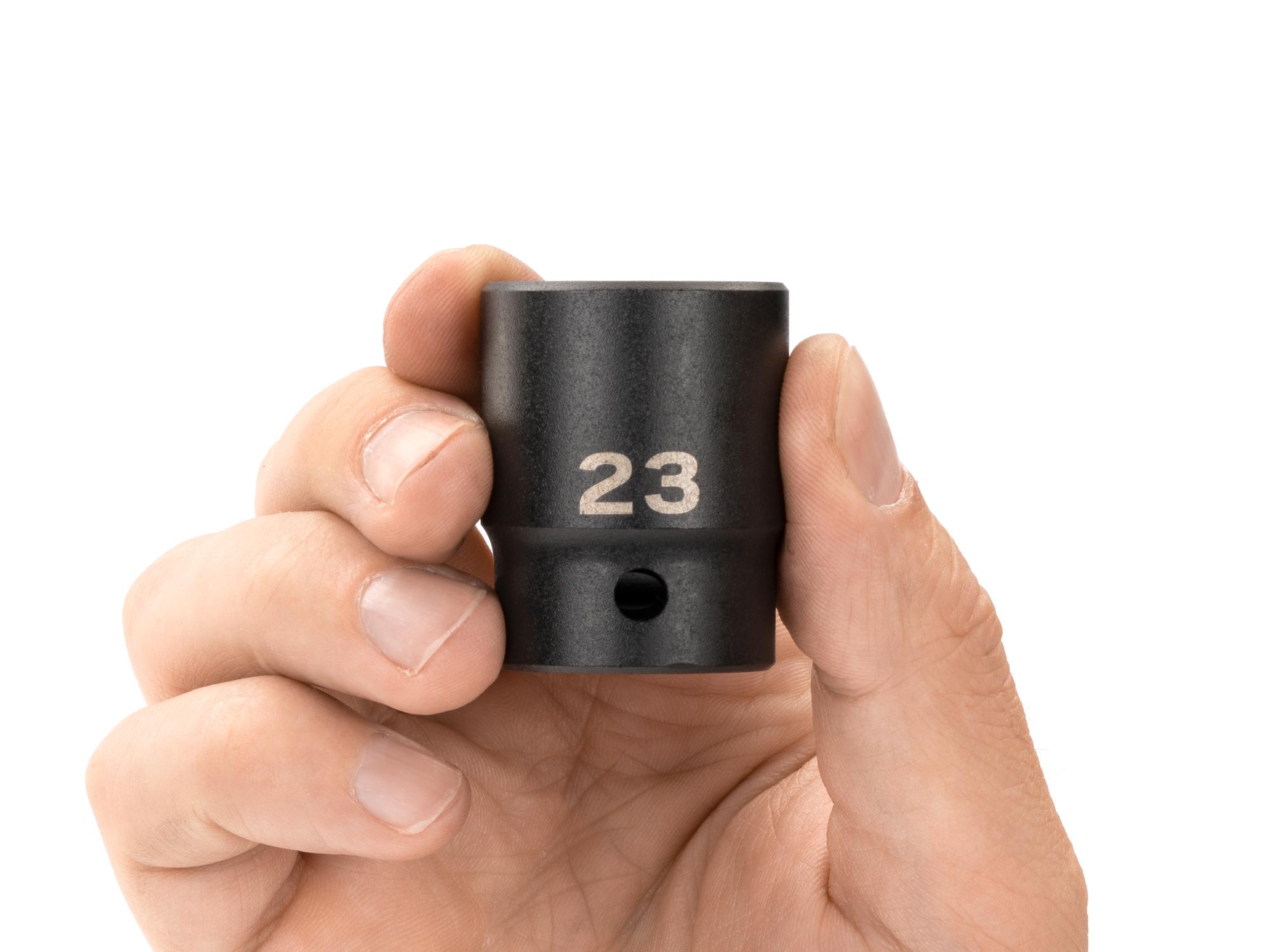 Person holding Tekton impact drive 12-point socket. Item #SID22323
