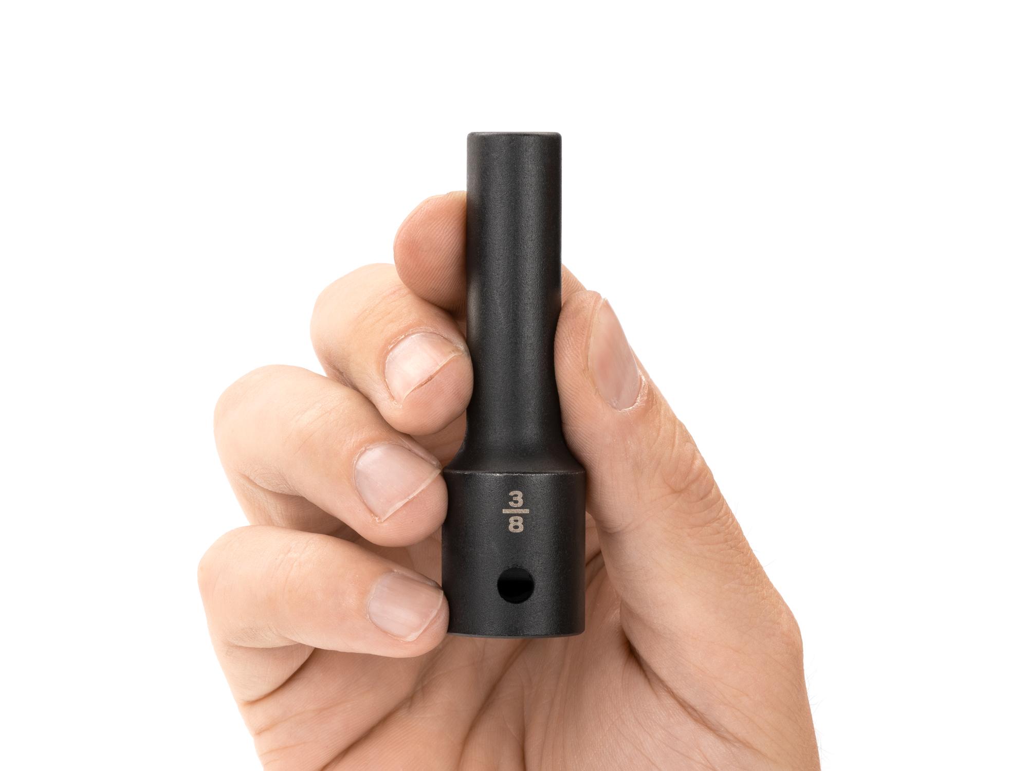 Person holding Tekton impact drive 12-point socket. Item #SID23210