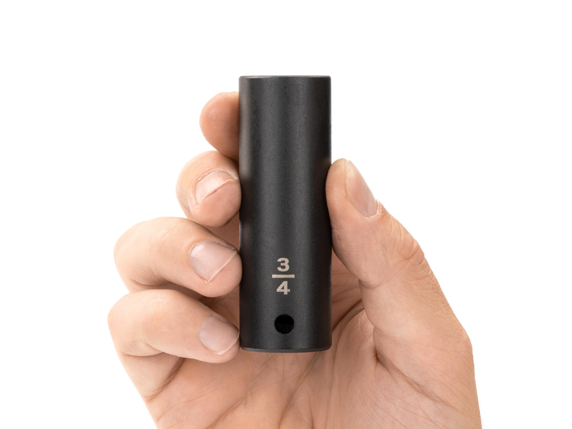 Person holding Tekton impact drive 12-point socket. Item #SID23219