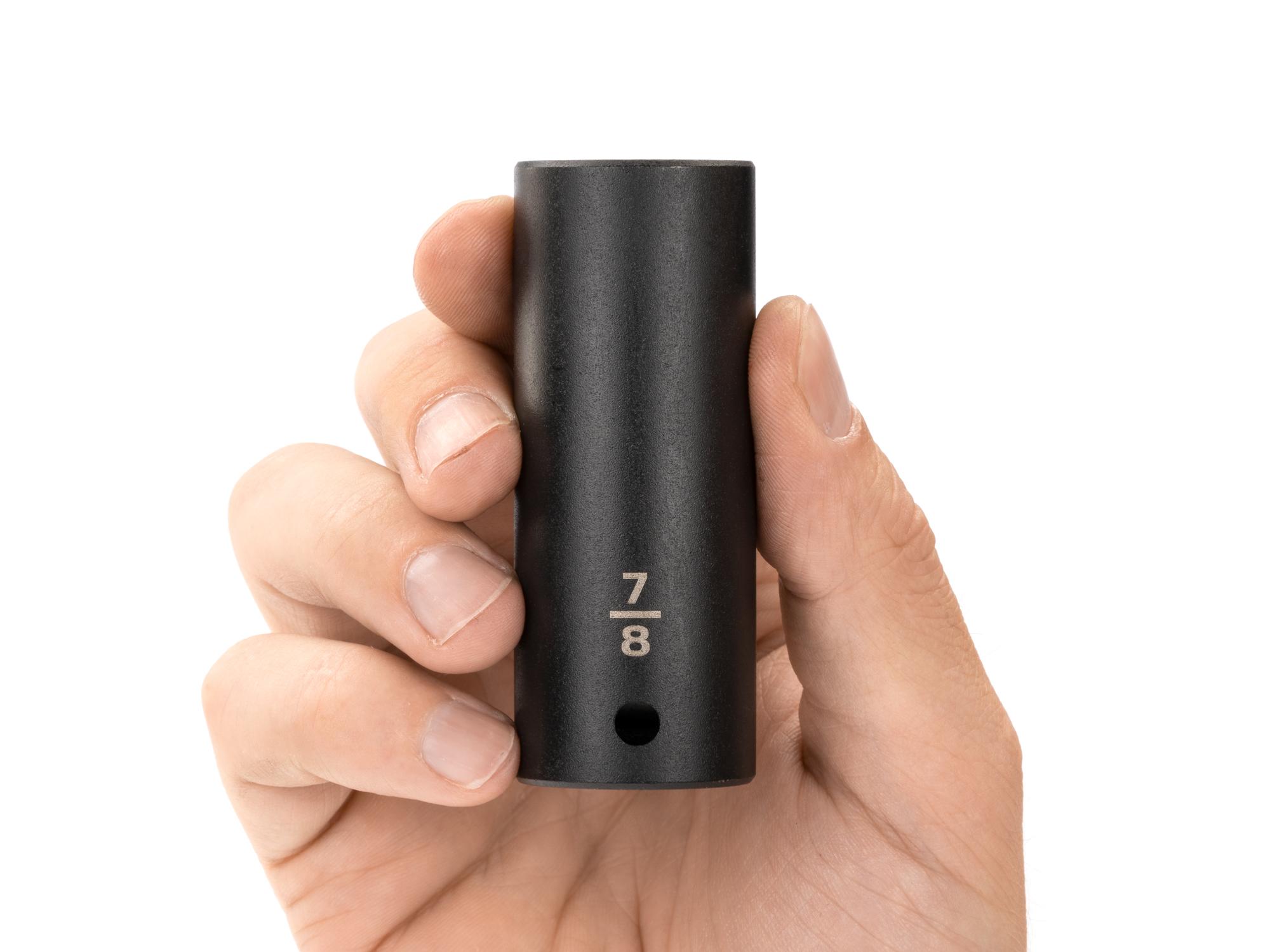 Person holding Tekton impact drive 12-point socket. Item #SID23222