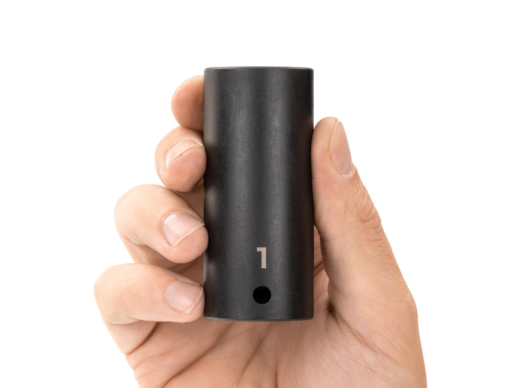 Person holding Tekton impact drive 12-point socket. Item #SID23225