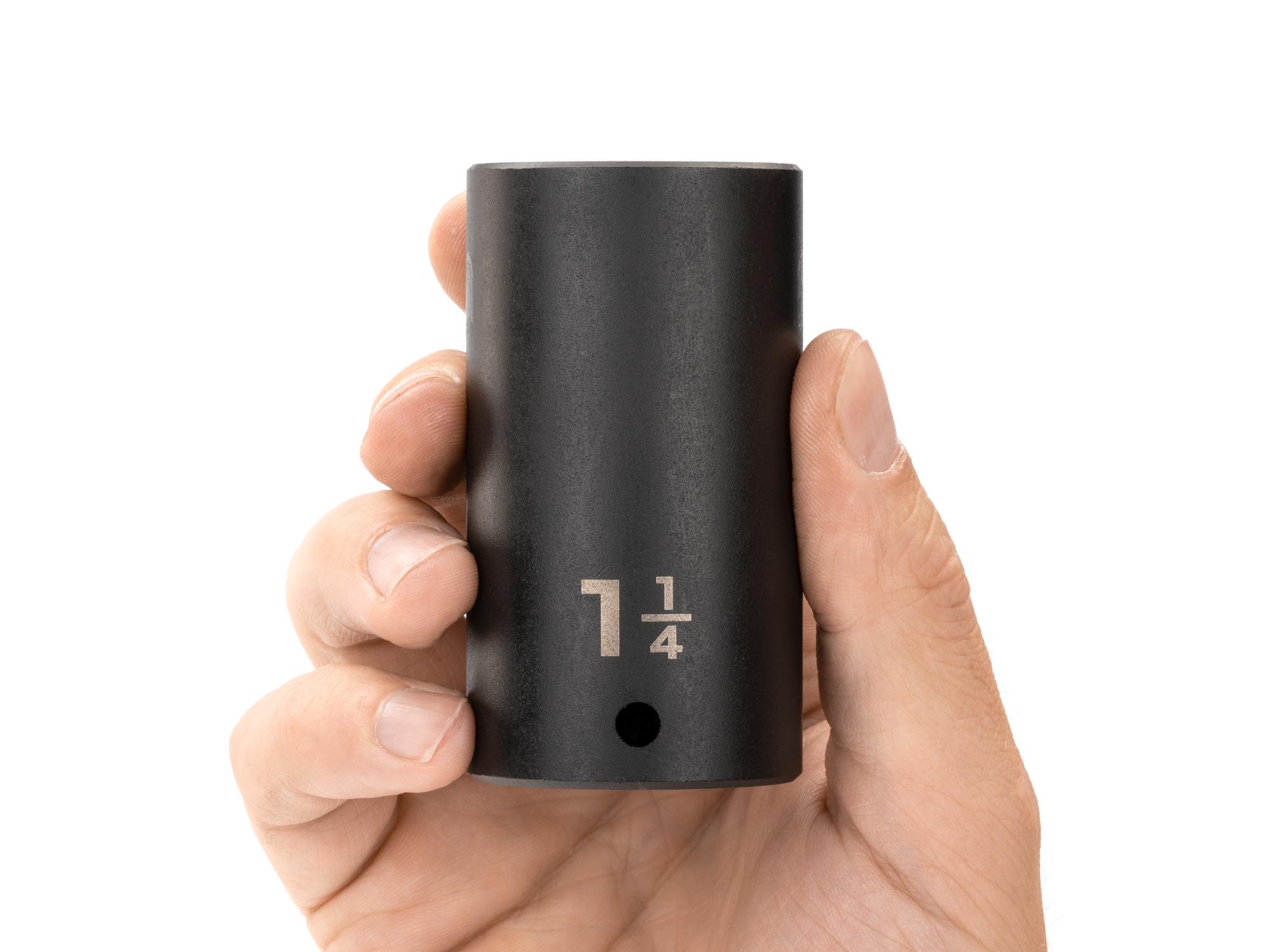Person holding Tekton impact drive 12-point socket. Item #SID23232