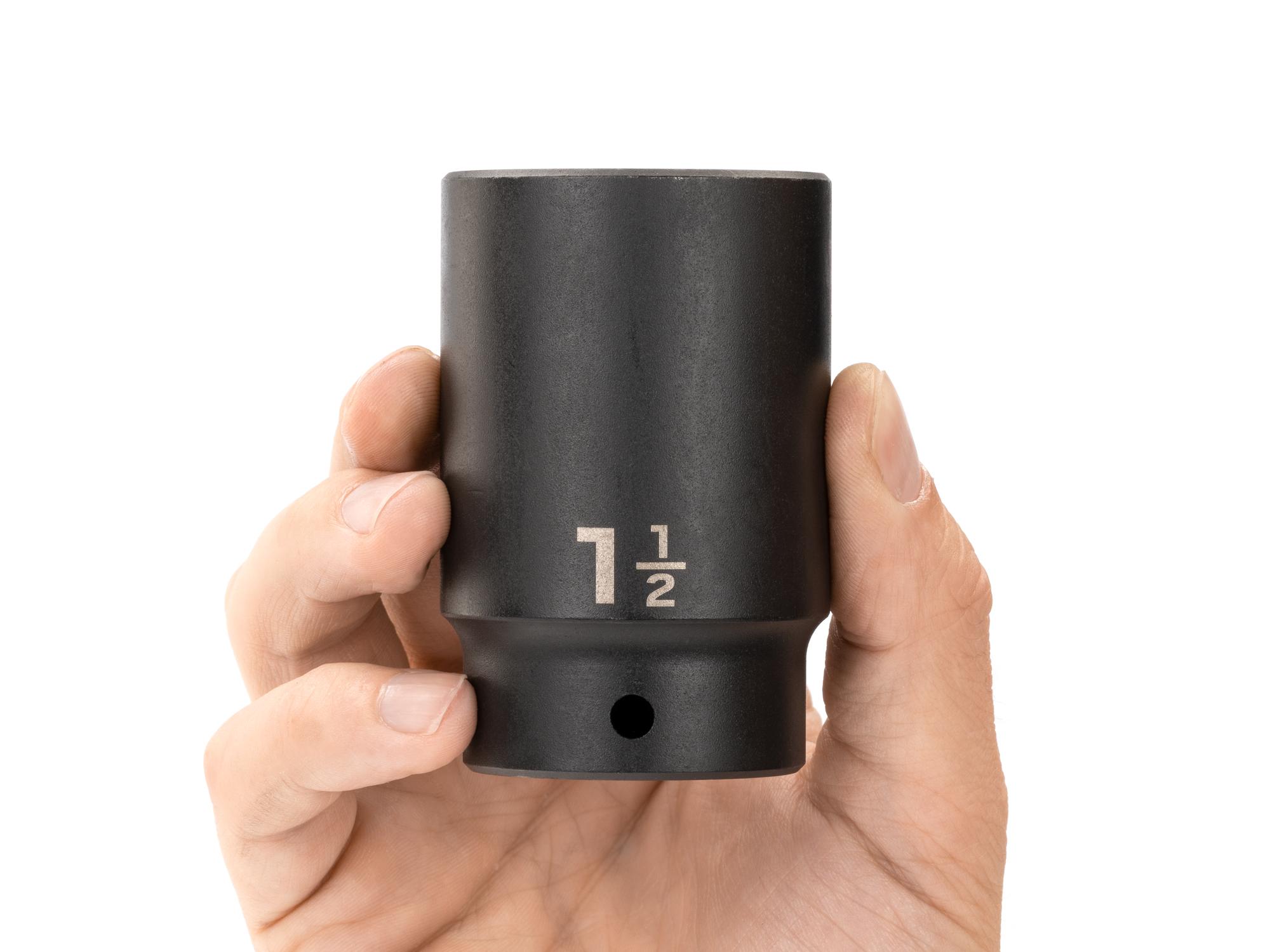 Person holding Tekton impact drive 12-point socket. Item #SID23238