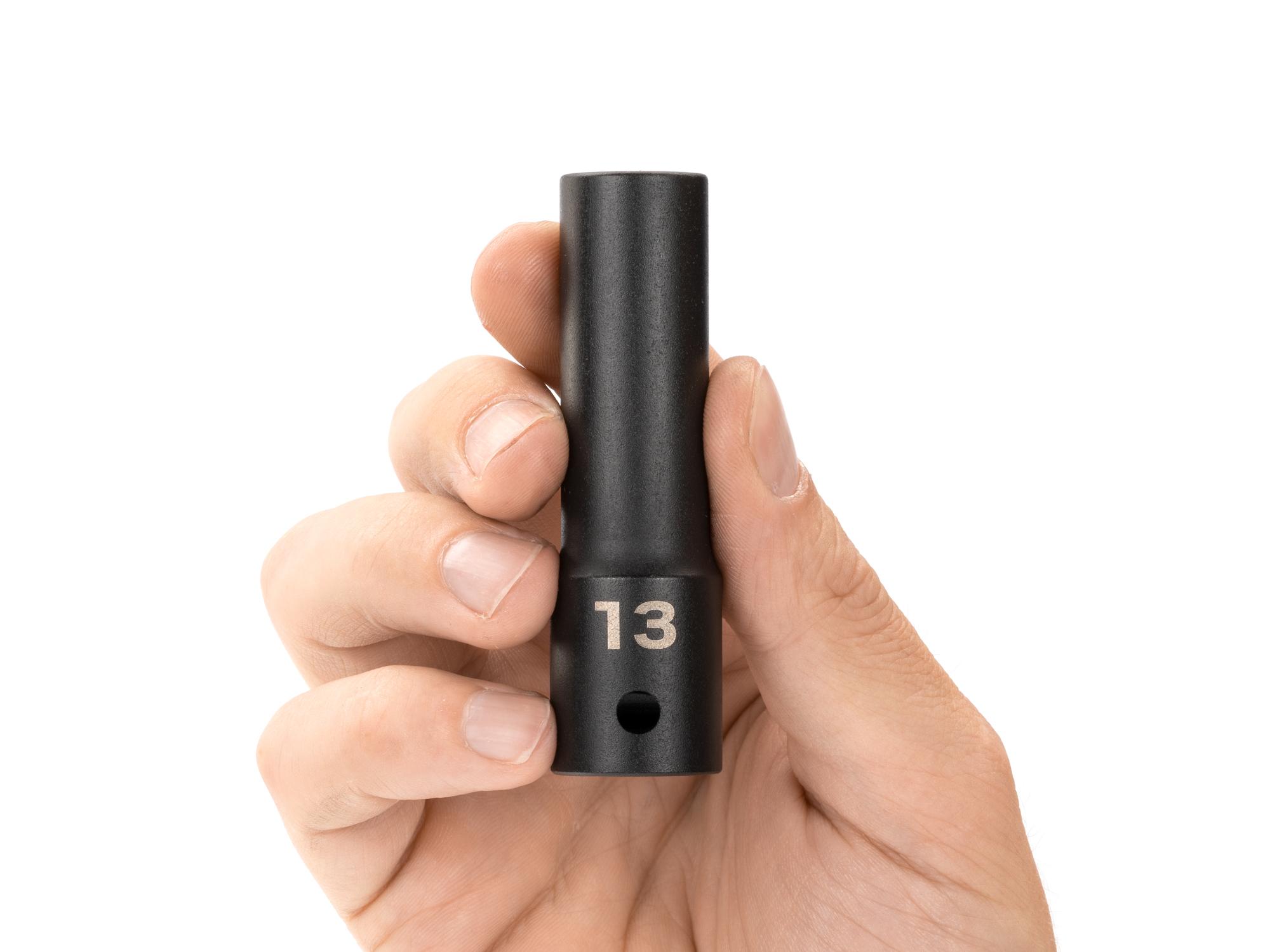 Person holding Tekton impact drive 12-point socket. Item #SID23313