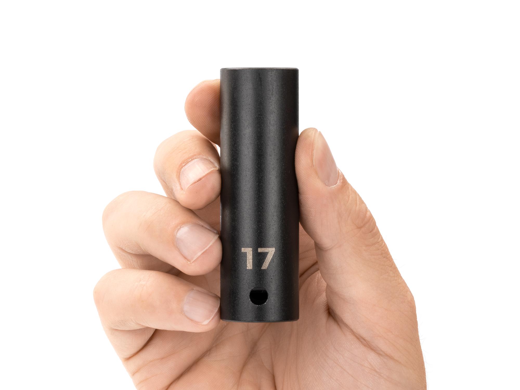 Person holding Tekton impact drive 12-point socket. Item #SID23317