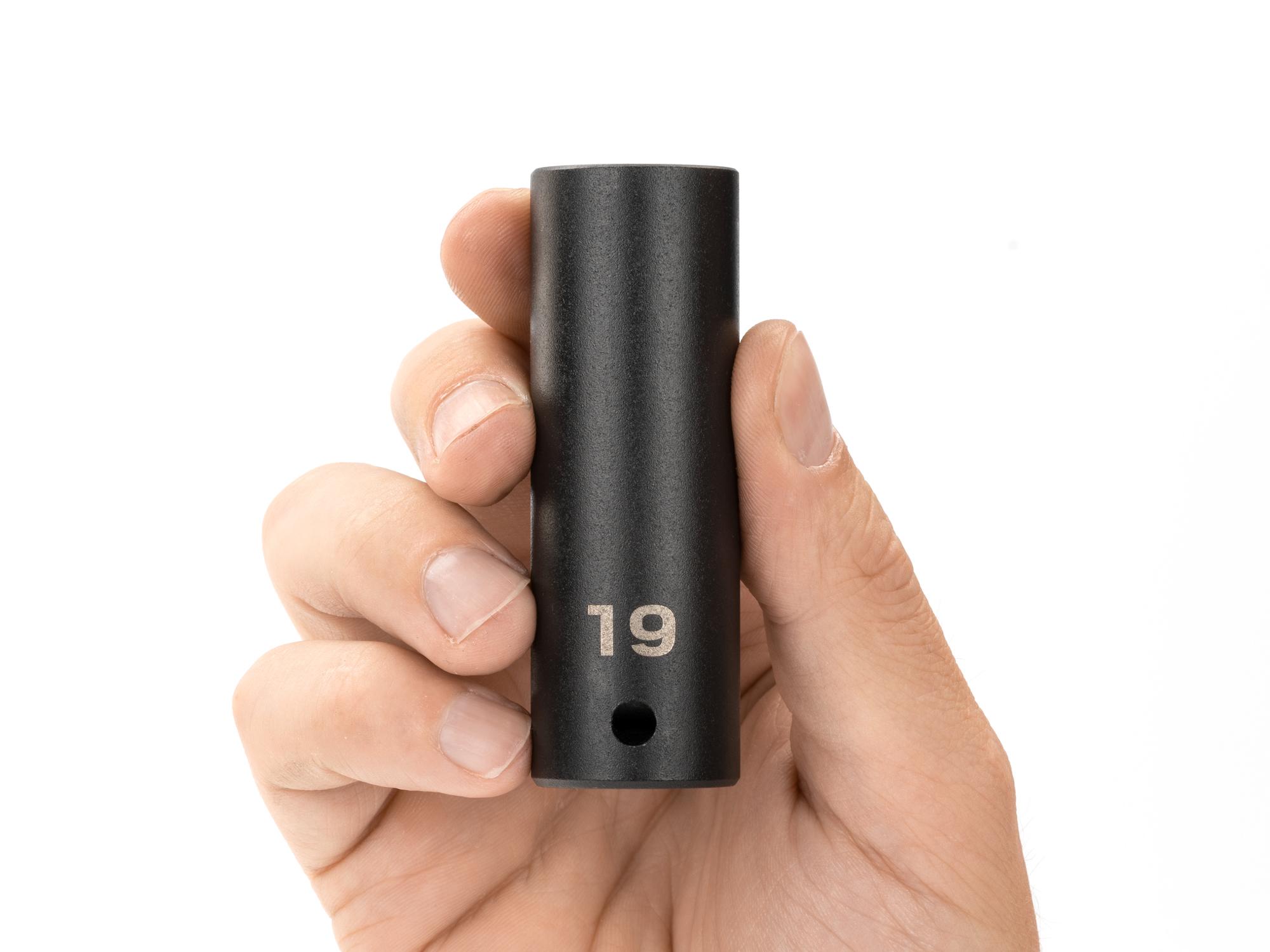 Person holding Tekton impact drive 12-point socket. Item #SID23319