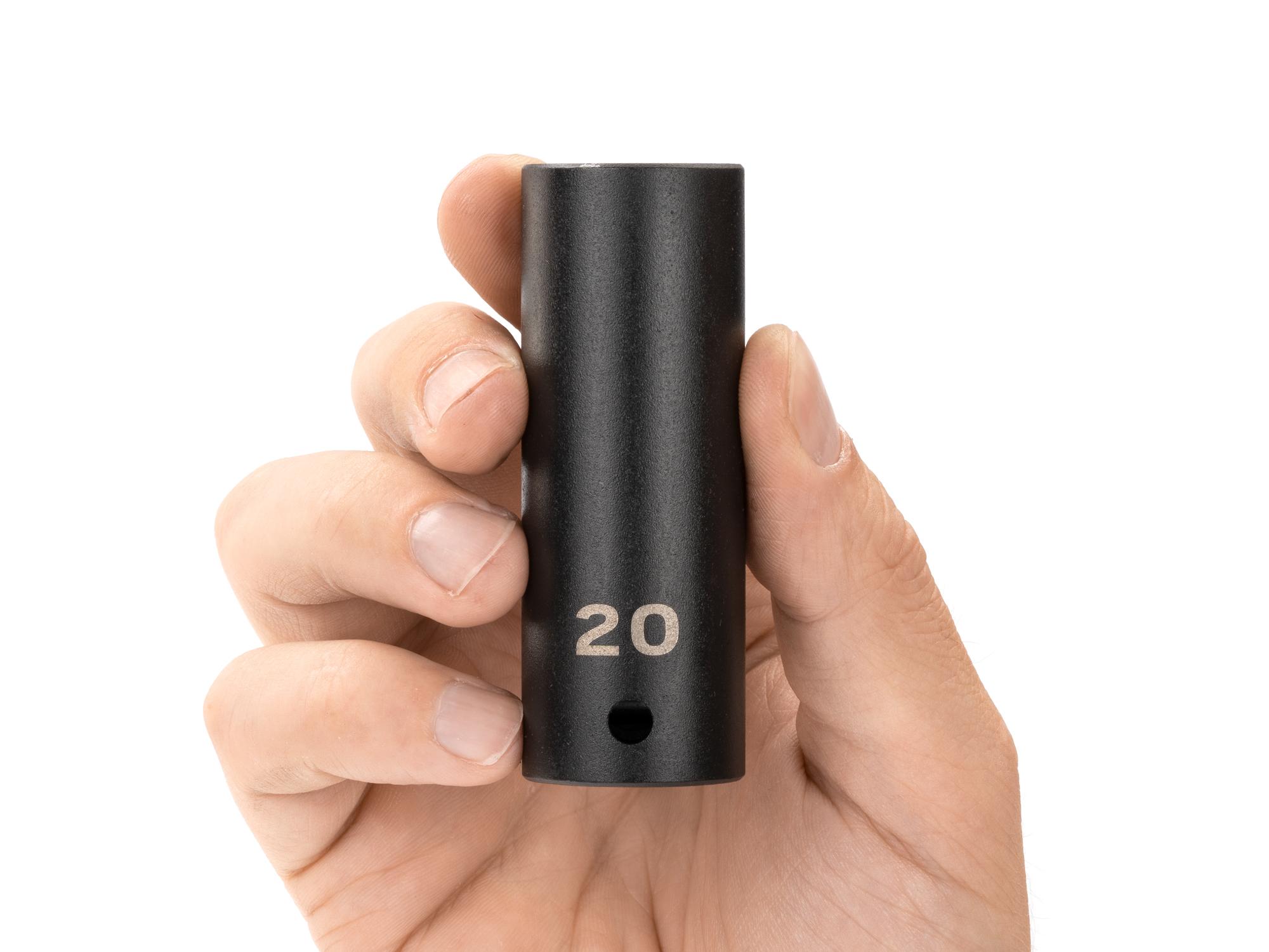Person holding Tekton impact drive 12-point socket. Item #SID23320