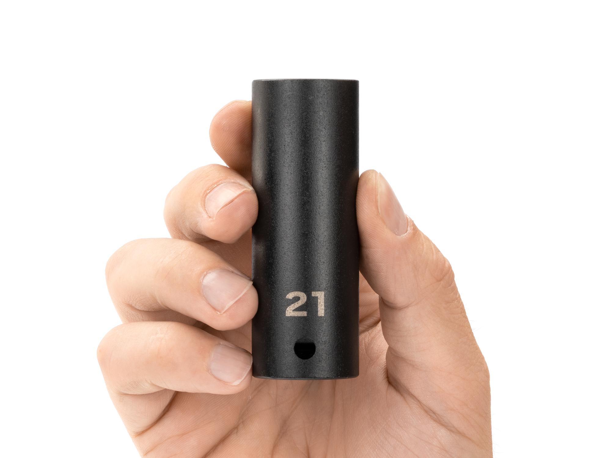 Person holding Tekton impact drive 12-point socket. Item #SID23321