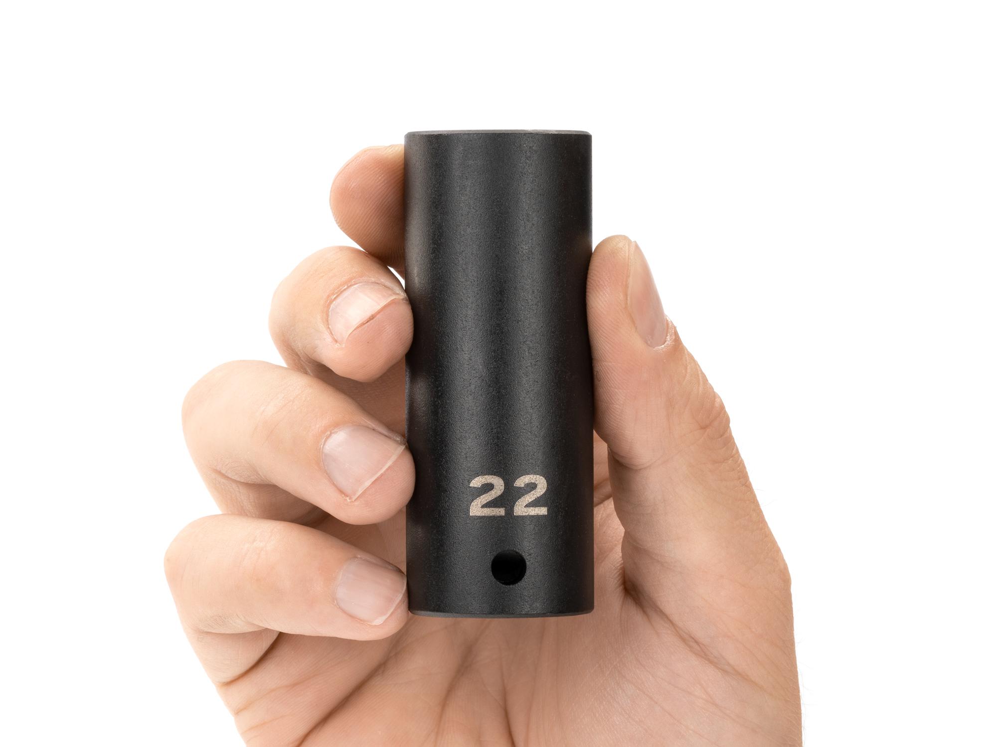 Person holding Tekton impact drive 12-point socket. Item #SID23322