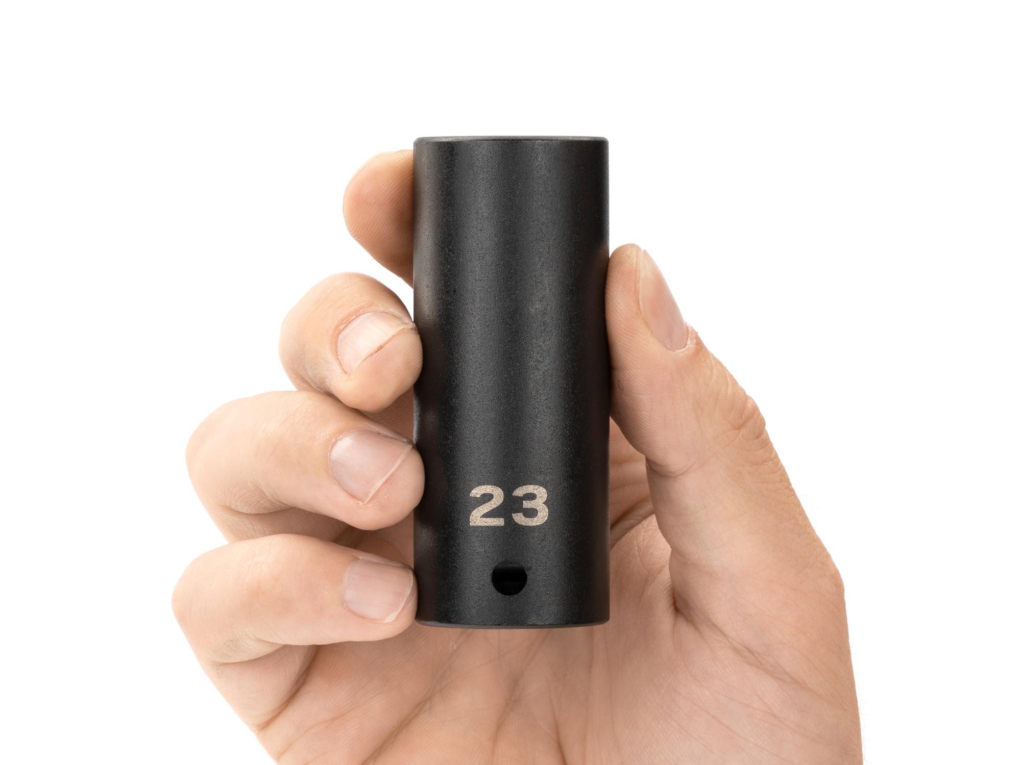 Person holding Tekton impact drive 12-point socket. Item #SID23323