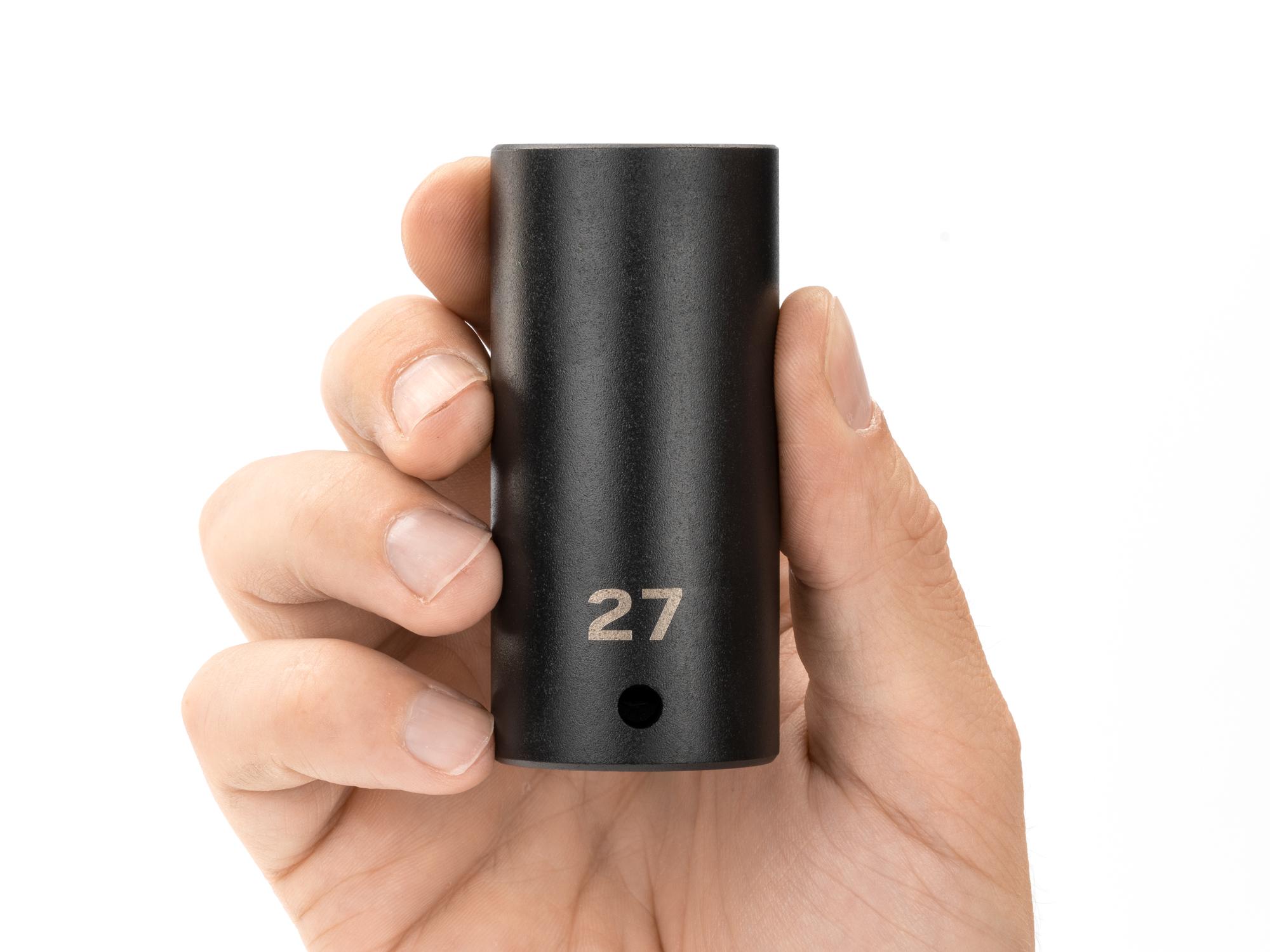 Person holding Tekton impact drive 12-point socket. Item #SID23327