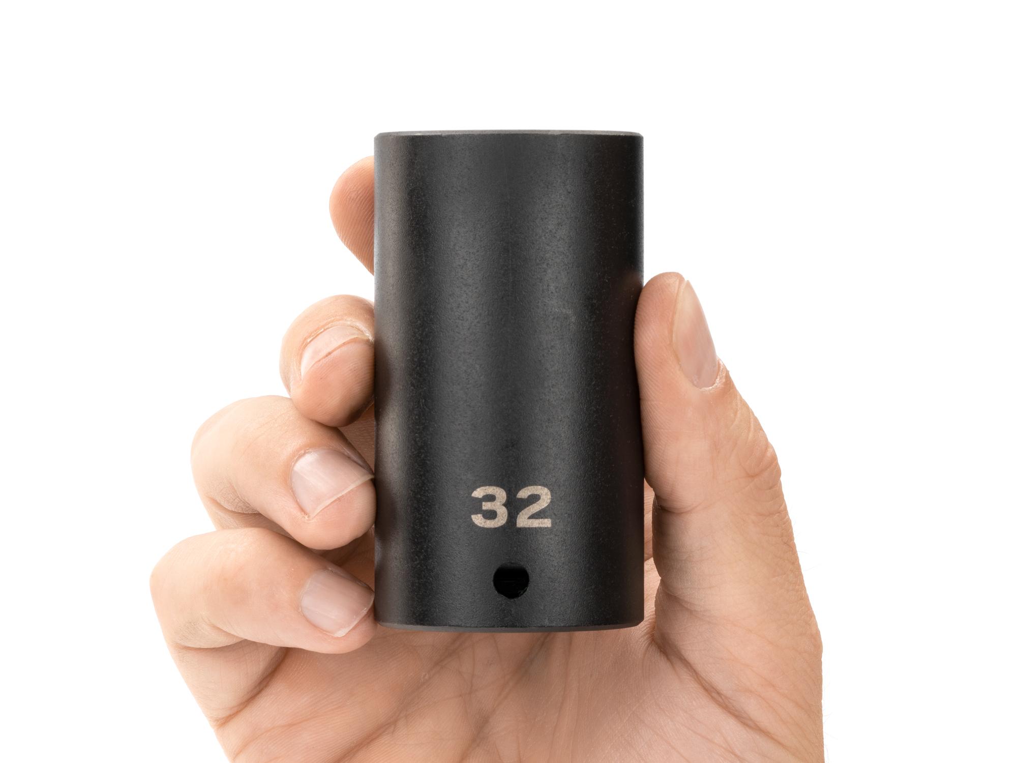 Person holding Tekton impact drive 12-point socket. Item #SID23332