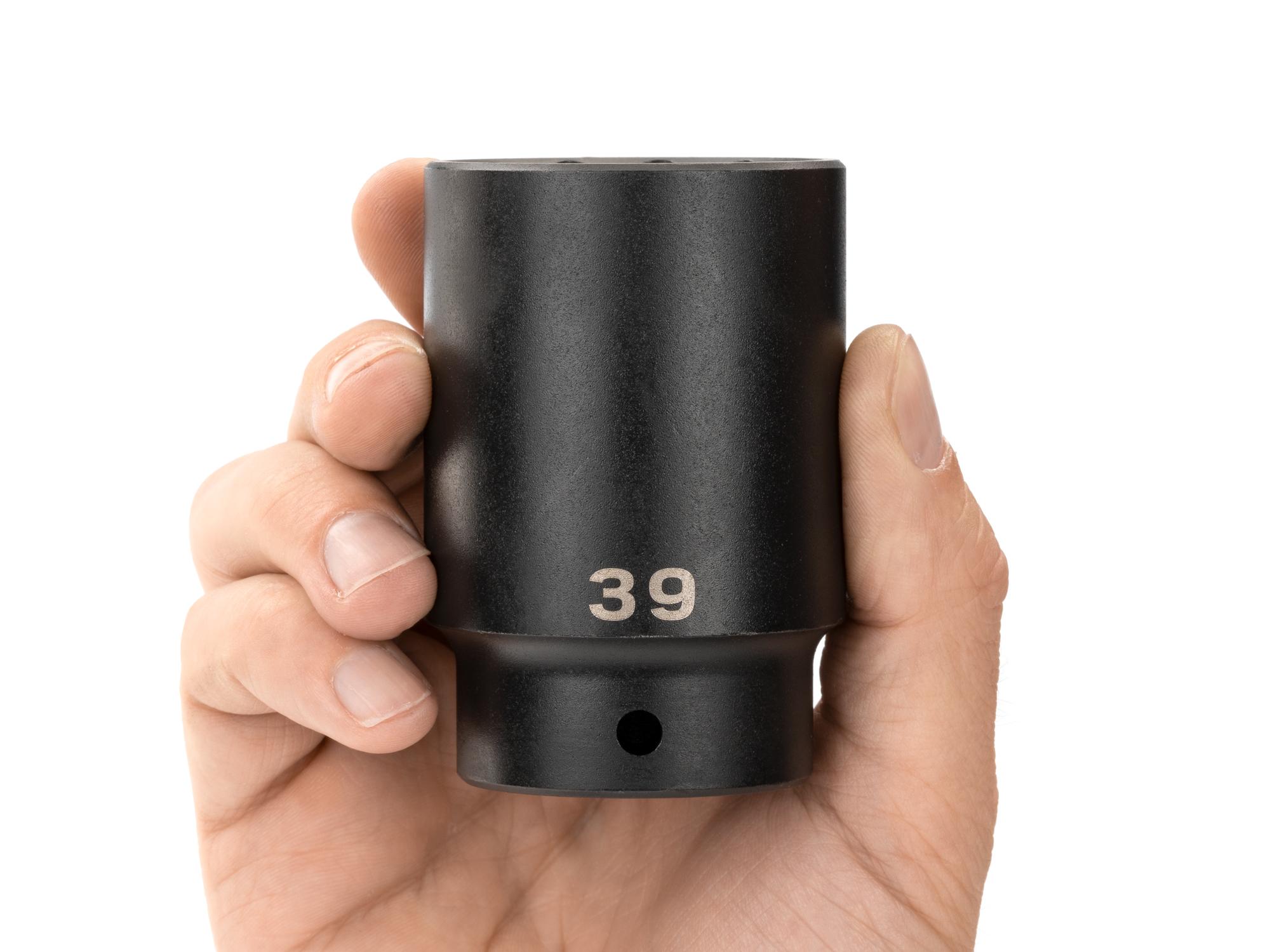 Person holding Tekton impact drive 12-point socket. Item #SID23339