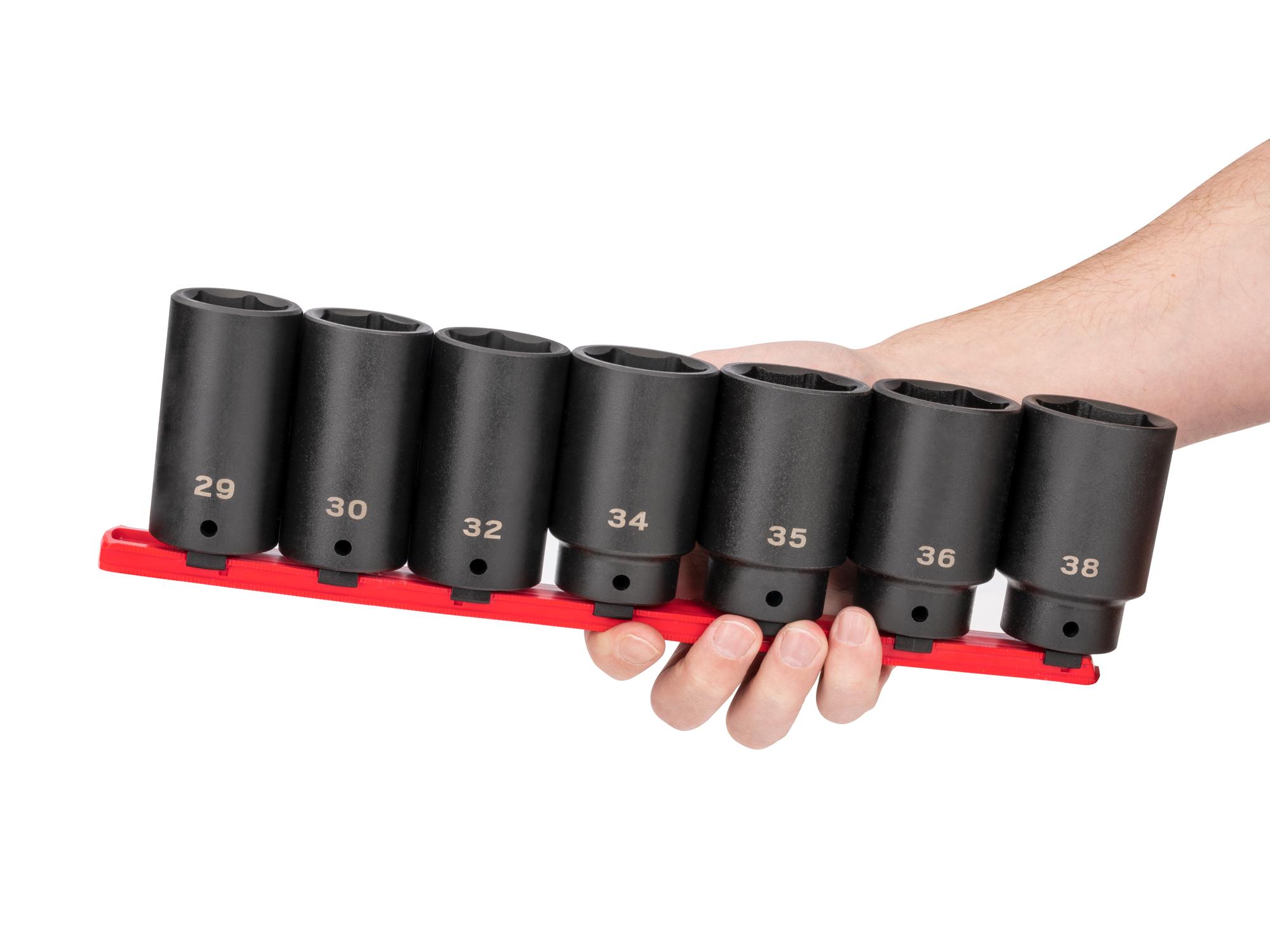 Person holding Tekton rail impact drive 6-point socket set. Item #SID92101