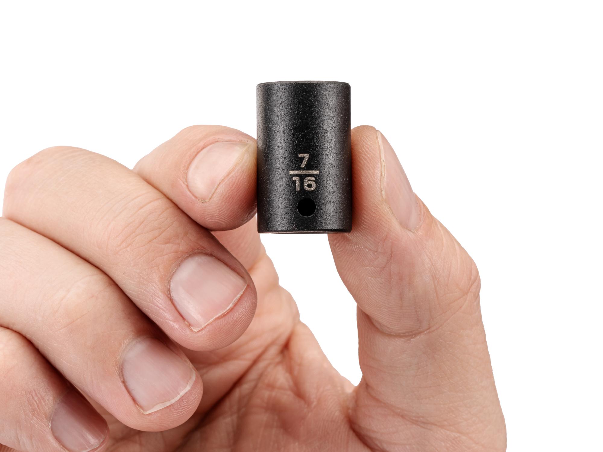 Person holding Tekton impact drive 6-point socket. Item #SID02011