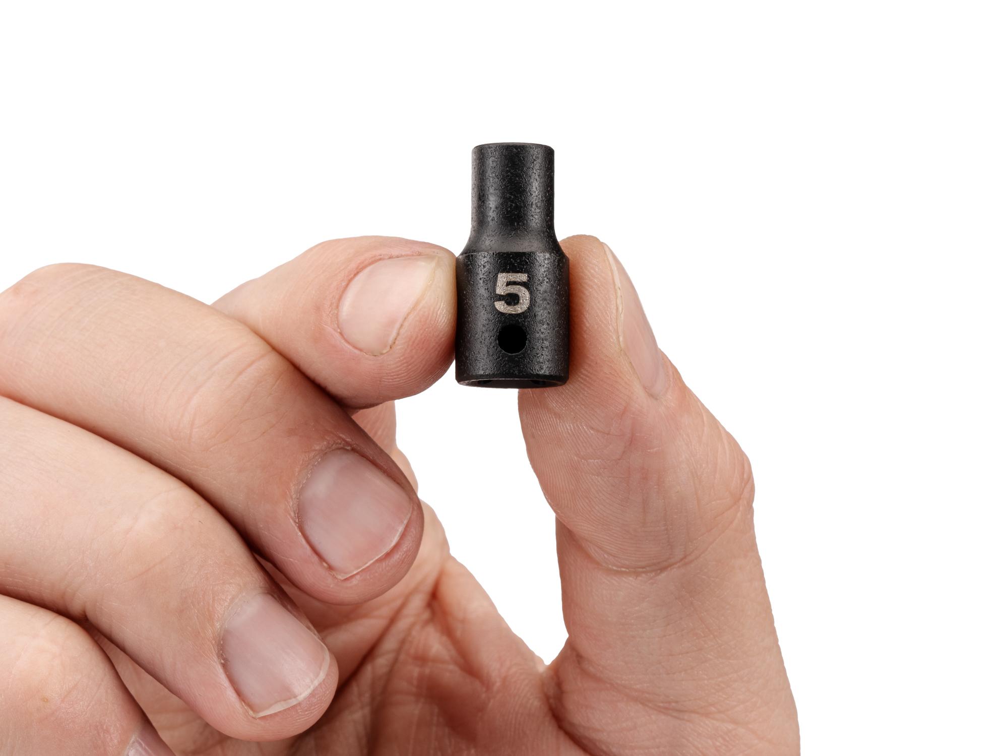 Person holding Tekton impact drive 6-point socket. Item #SID02104
