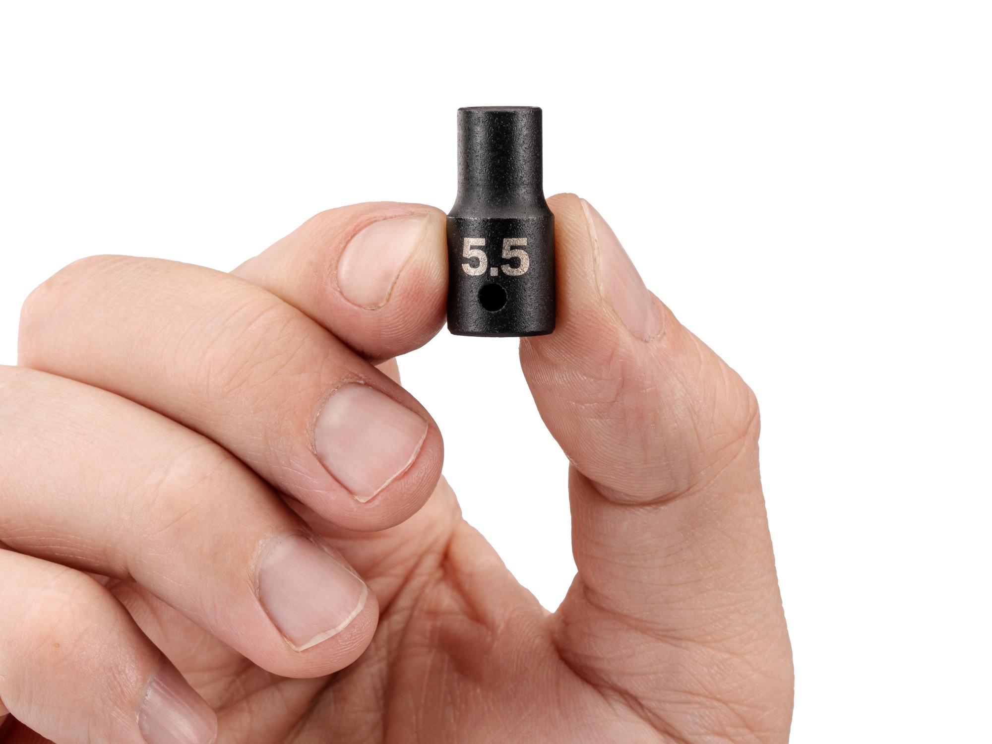 Person holding Tekton impact drive 6-point socket. Item #SID02105