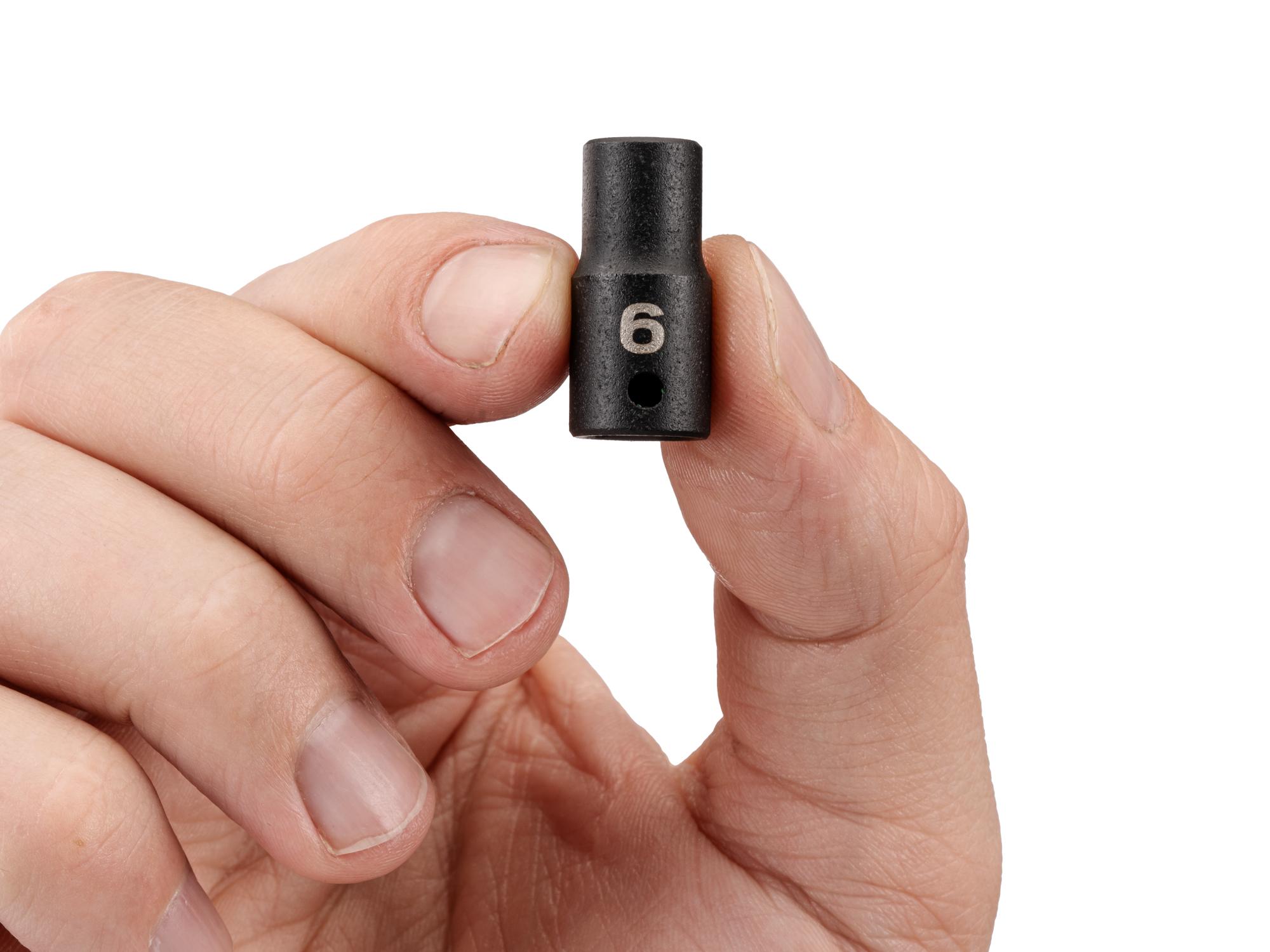 Person holding Tekton impact drive 6-point socket. Item #SID02106