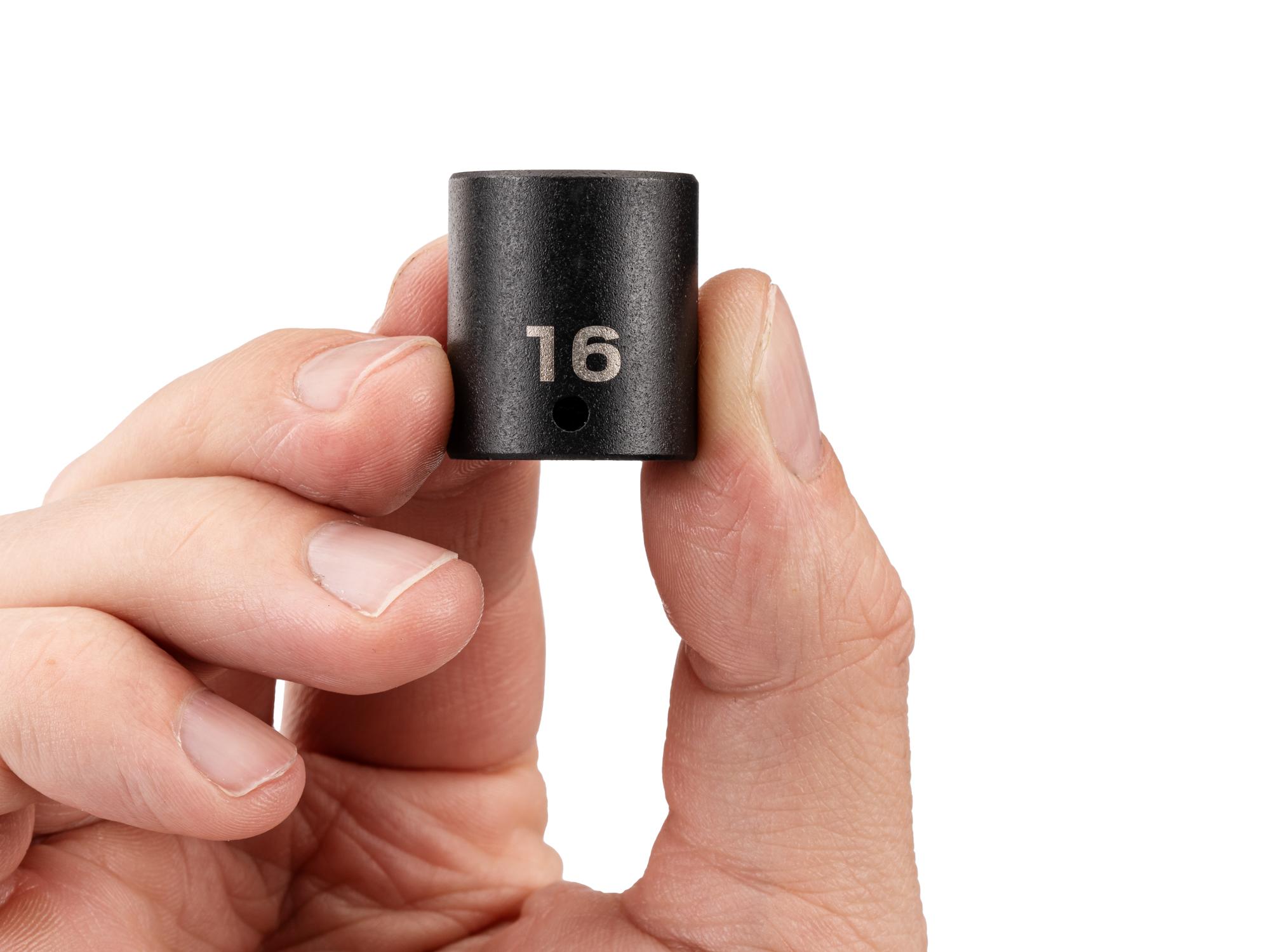 Person holding Tekton impact drive 6-point socket. Item #SID02116