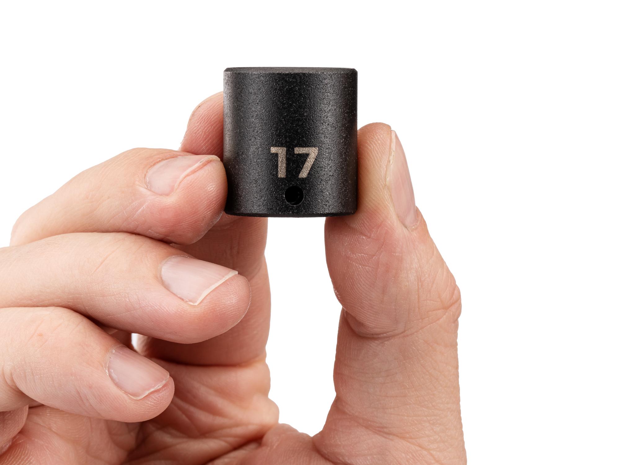 Person holding Tekton impact drive 6-point socket. Item #SID02117