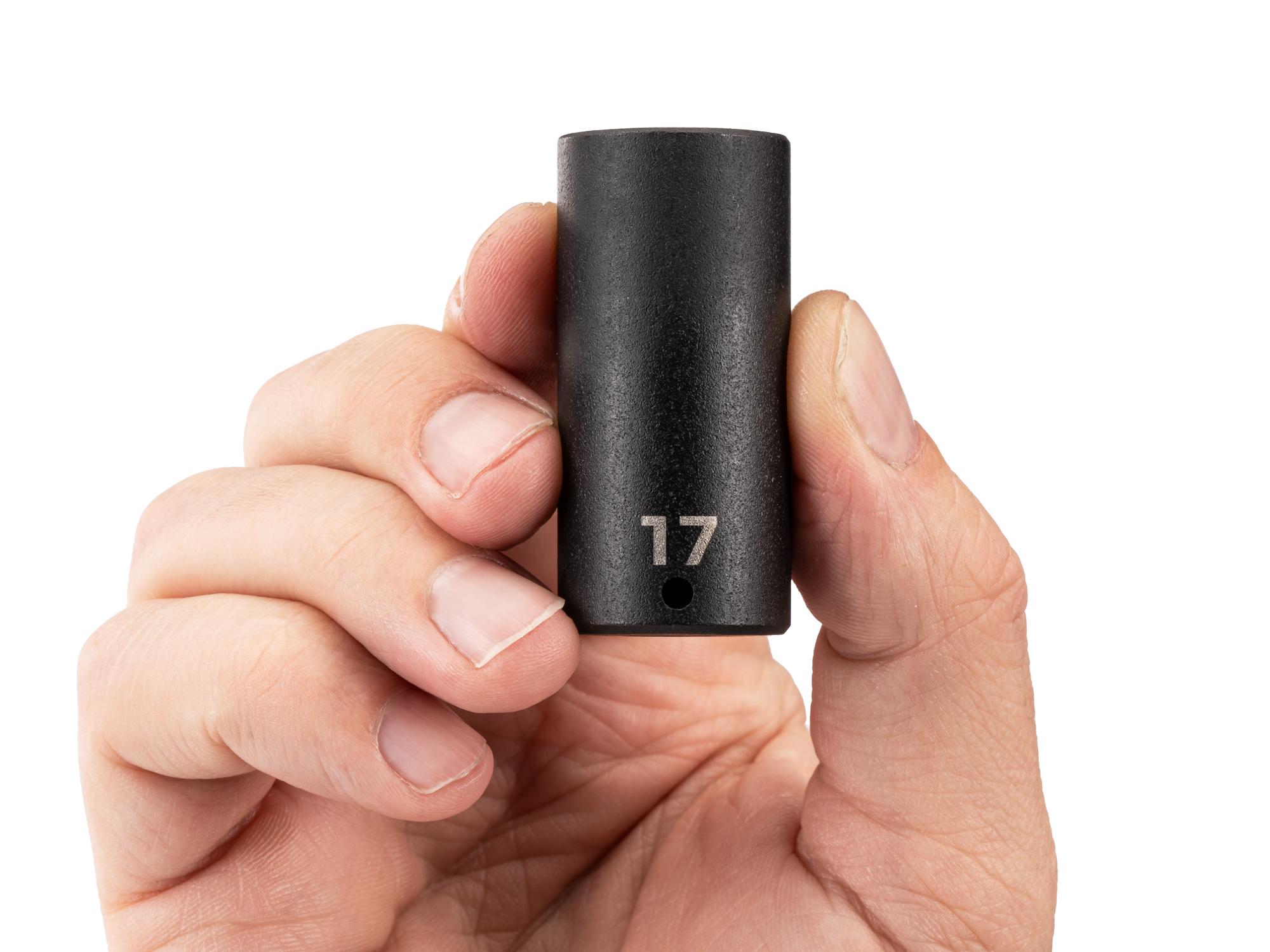 Person holding Tekton impact drive 6-point socket. Item #SID03117