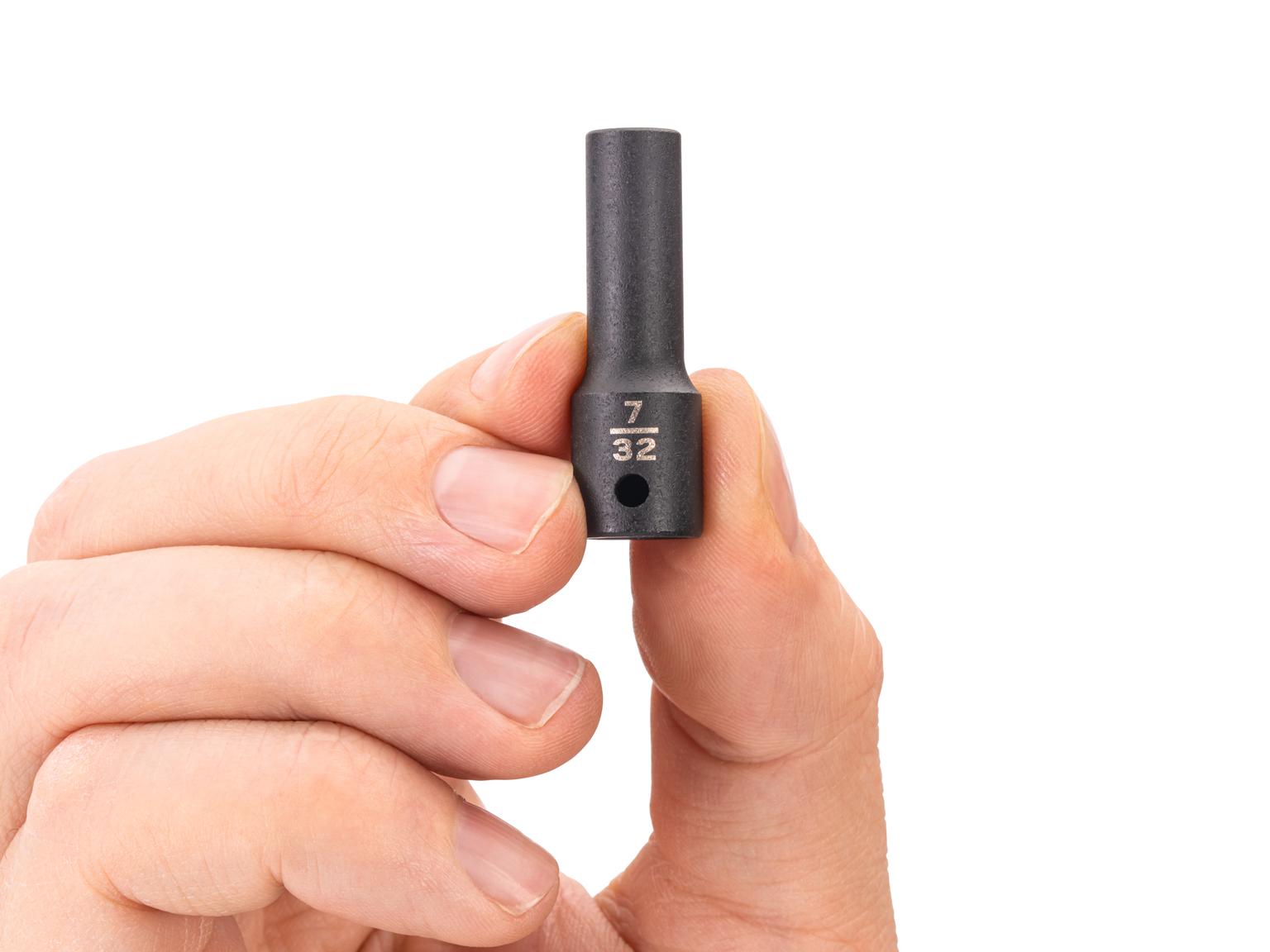 Person holding Tekton impact drive 6-point socket. Item #SID04005