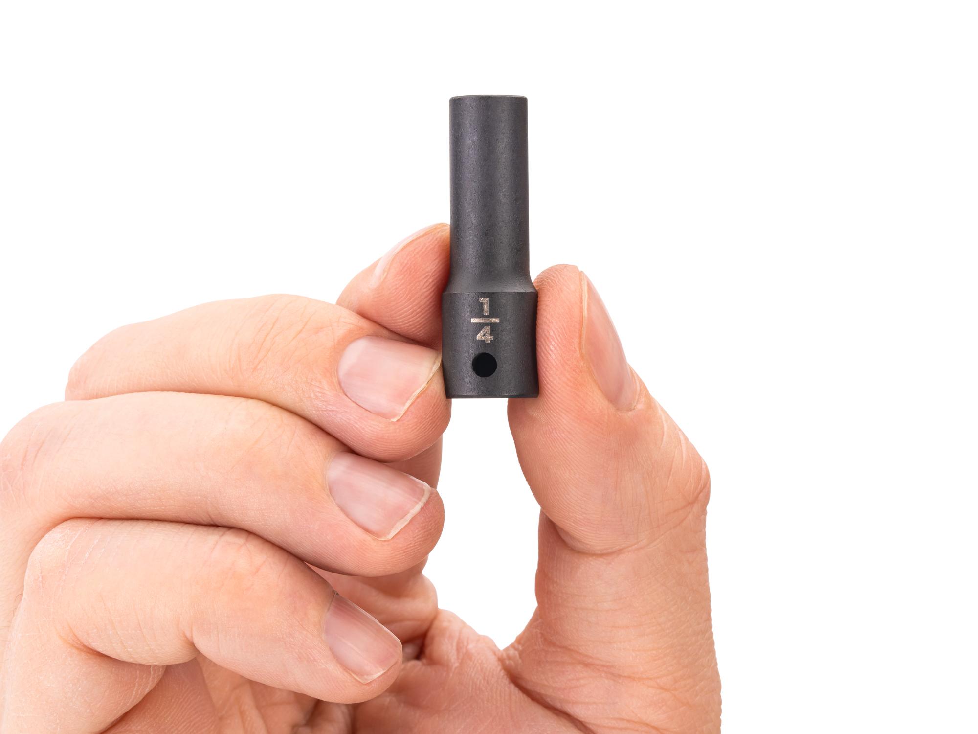 Person holding Tekton impact drive 6-point socket. Item #SID04006