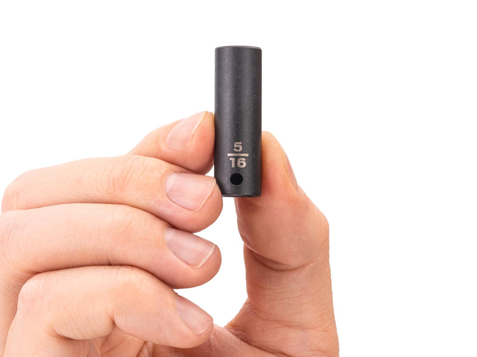 Person holding Tekton impact drive 6-point socket. Item #SID04008