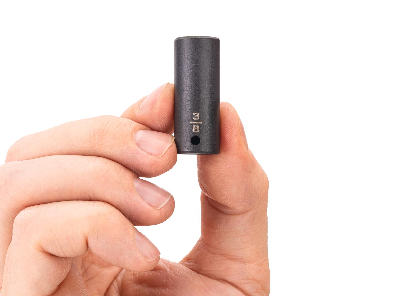 Person holding Tekton impact drive 6-point socket. Item #SID04010