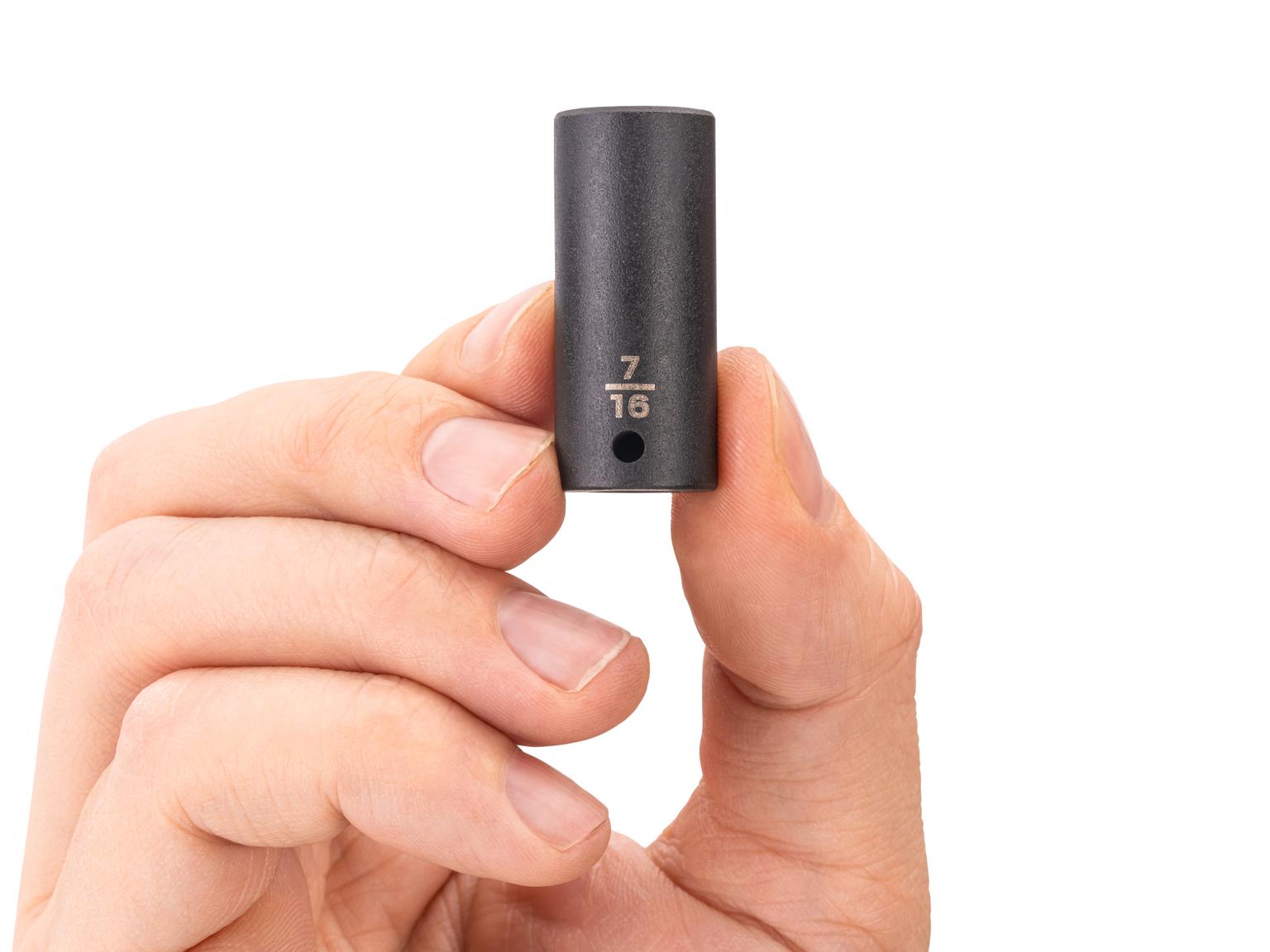 Person holding Tekton impact drive 6-point socket. Item #SID04011